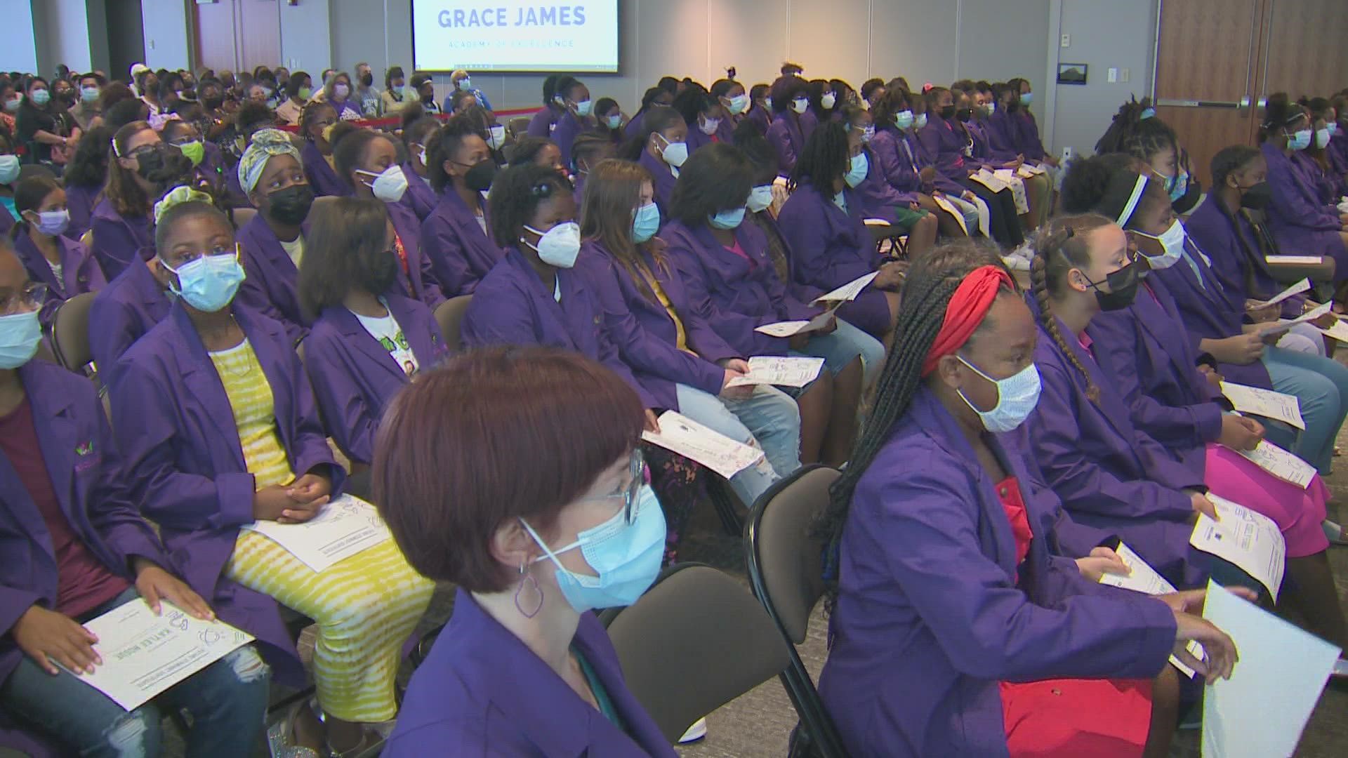 The incoming sixth-graders received their purple lab coats from women in the STEAM fields, which is the curriculum focus at the all-girls academy.