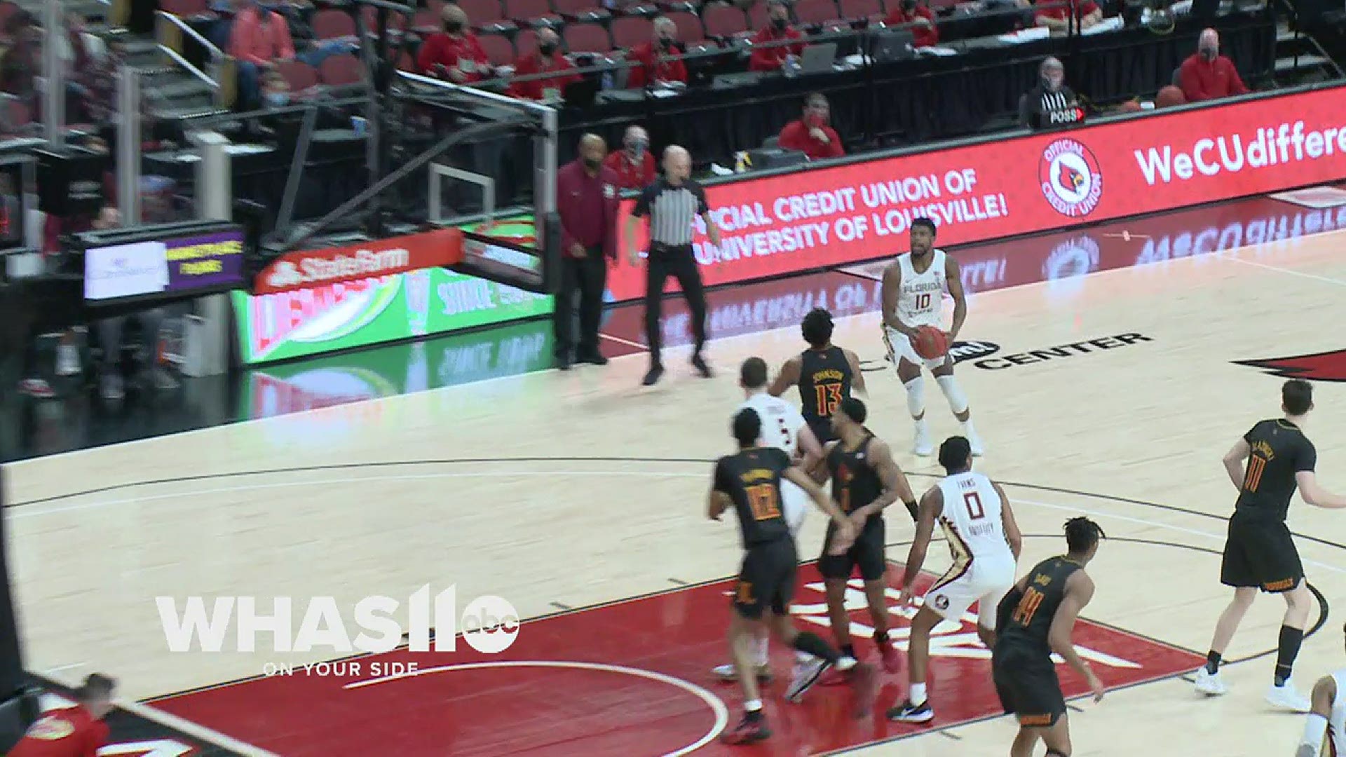 Florida State's Malik Osborne throws down a thunderous dunk over Louisville's JJ Traynor.