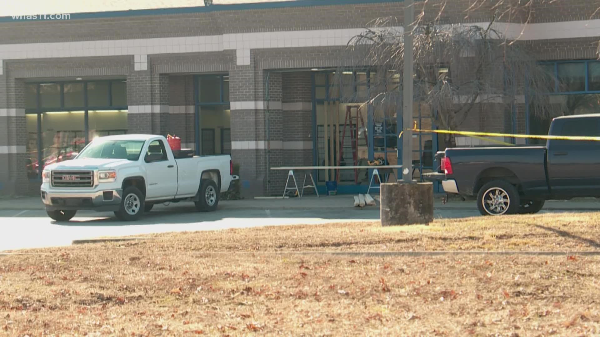 A Louisville man is facing charges after police say he drove into an Okolona post office pinning a man up against the wall inside.