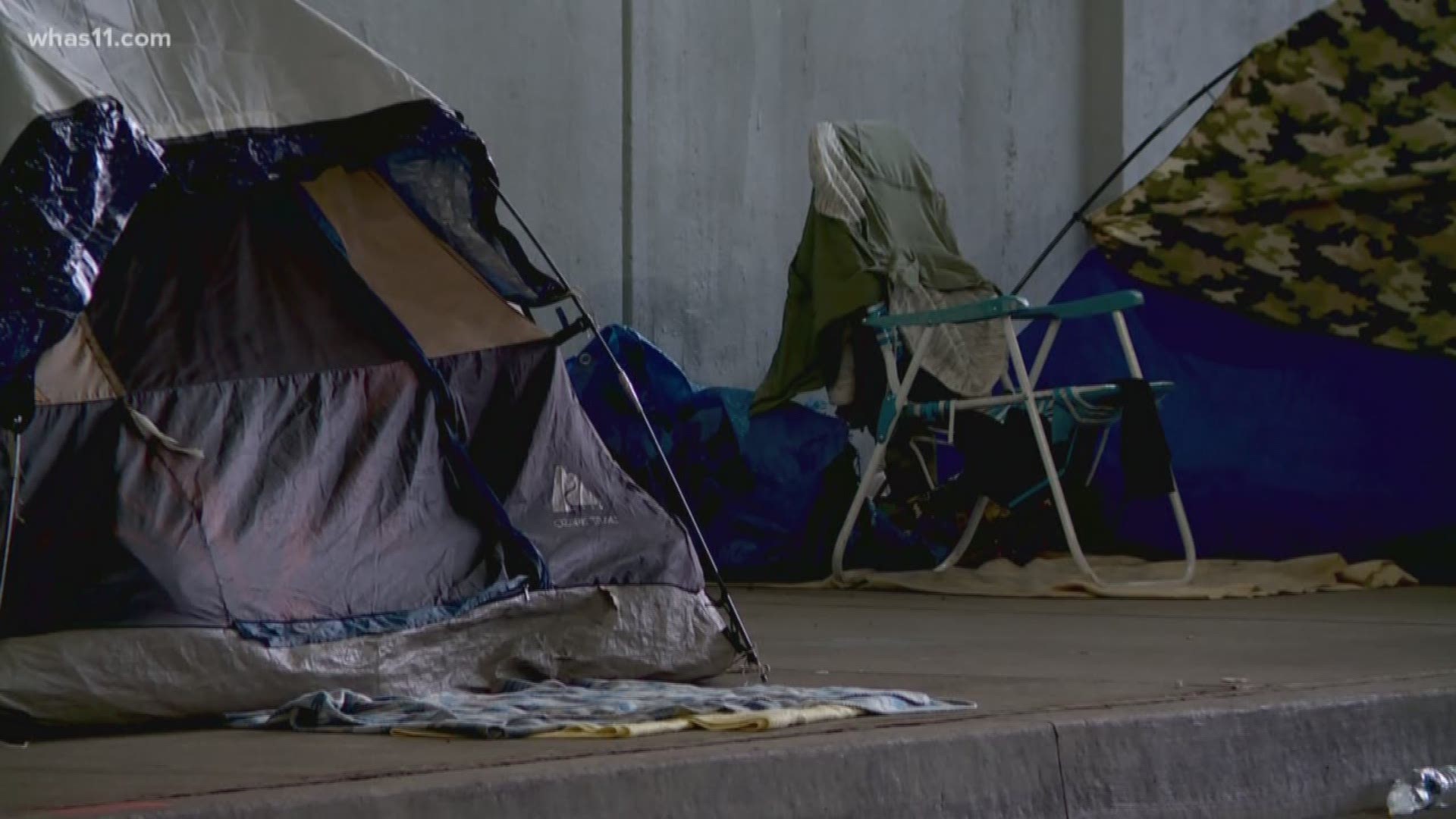 Between 50 and 60 people were cleared from a Downtown Louisville homeless camp.