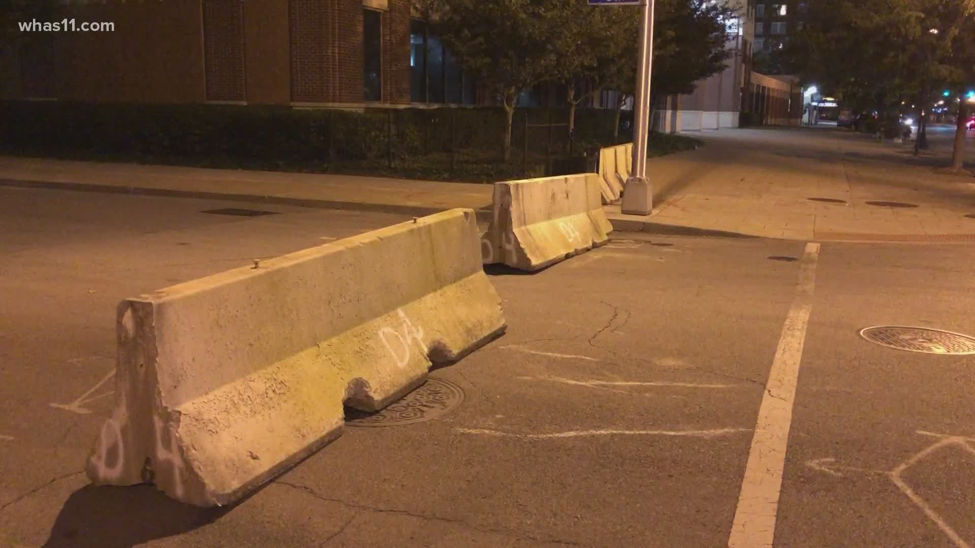 Early Tuesday morning, LMPD began placing barricades near Jefferson Square Park in downtown Louisville to restrict traffic.