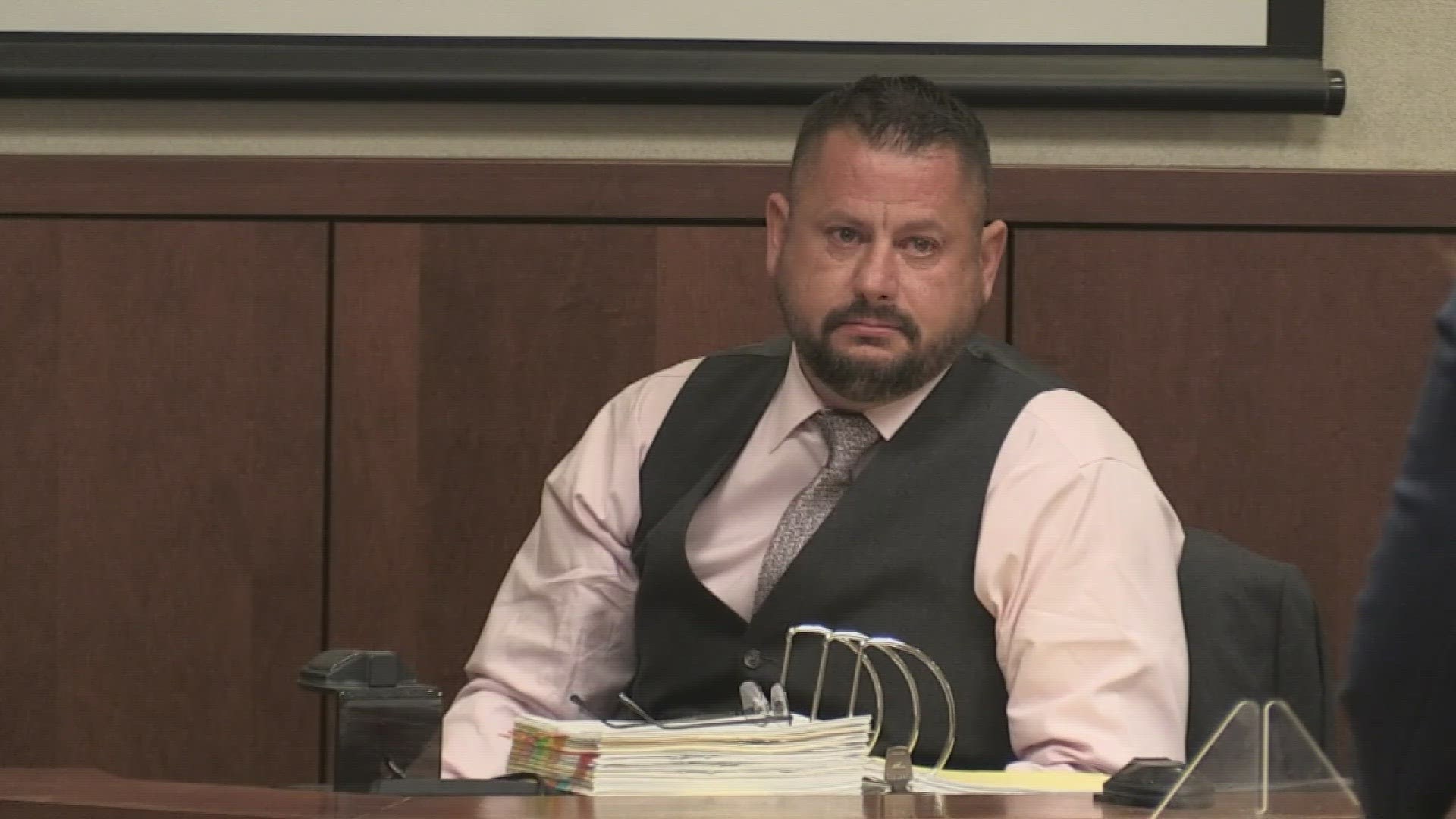 Detective Aaron Tinelli fought back emotions during Friday's testimony in one of Louisville's most heinous murder trials.