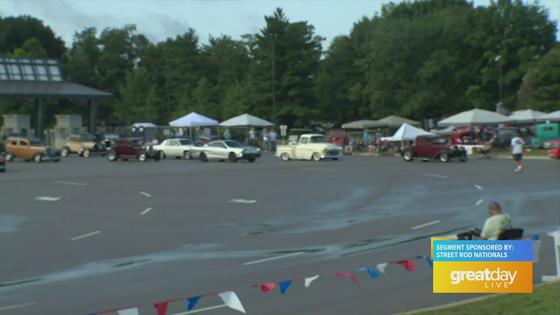 Reporter Elle Bottom speaks to car show enthusiast about his anticipation for the event