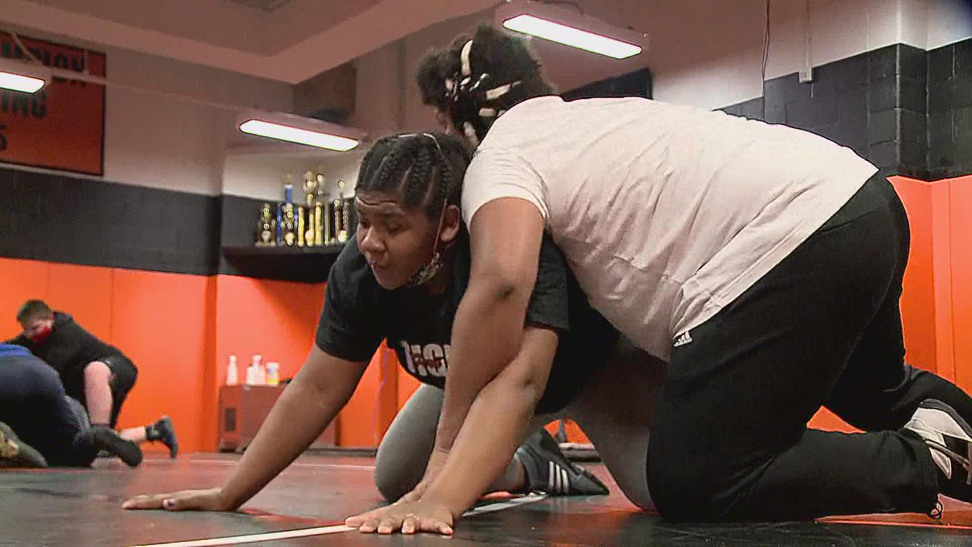 A two-time female heavyweight Kentucky state wrestling champ worries she won't get the chance to defend her title this year after her weight class is cut.
