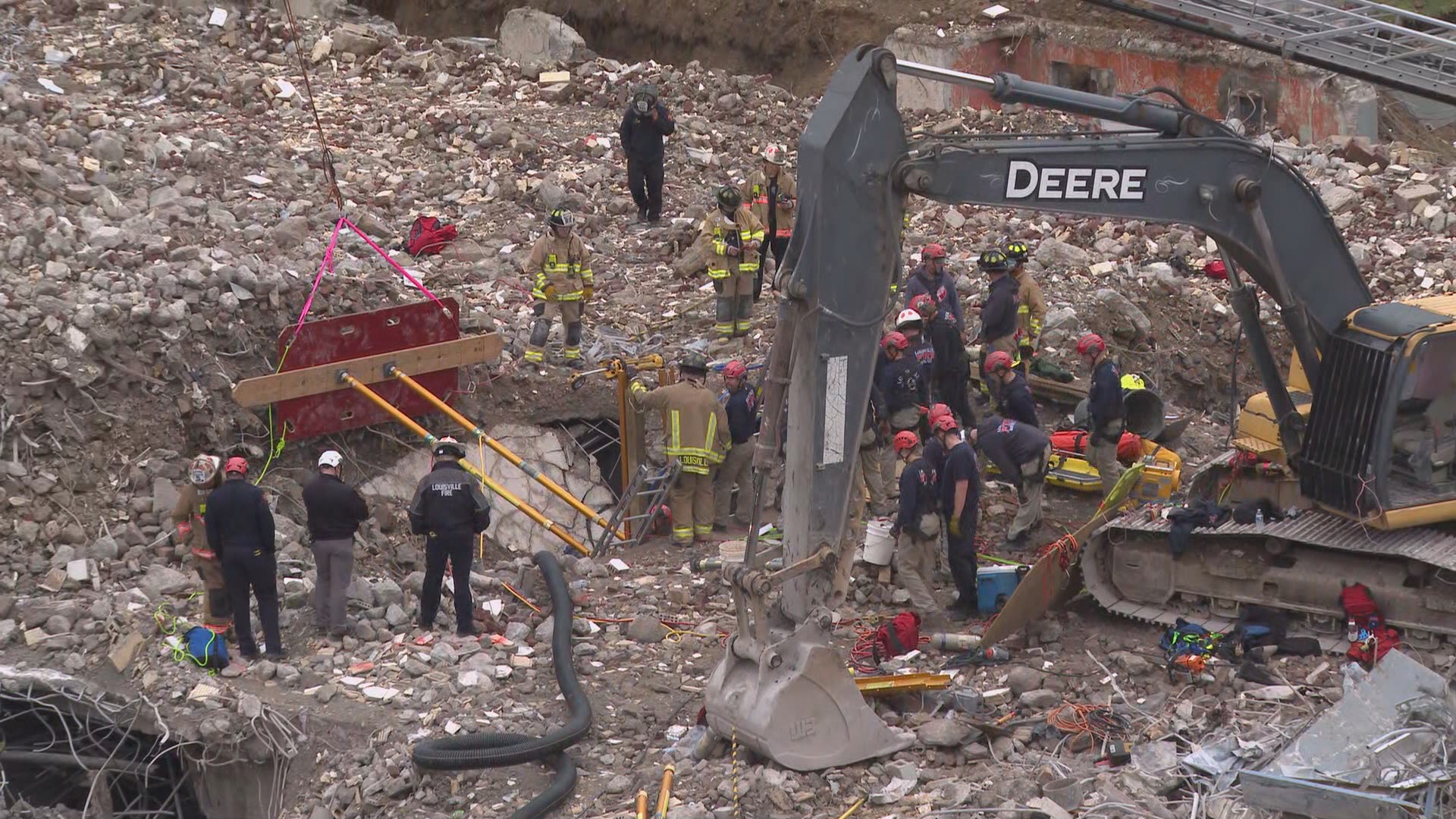 A worker is trapped in the rubble after a collapse at a construction site demo in downtown Louisville. They are communicating with first responders.