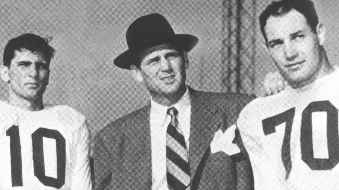 Coach Paul Bryant, second from left, gives affectionate hugs to his three  big offensive players in the Kentucky Wildcats victory over Texas Christian  University in the Cotton Bowl Game Jan. 1, 1952