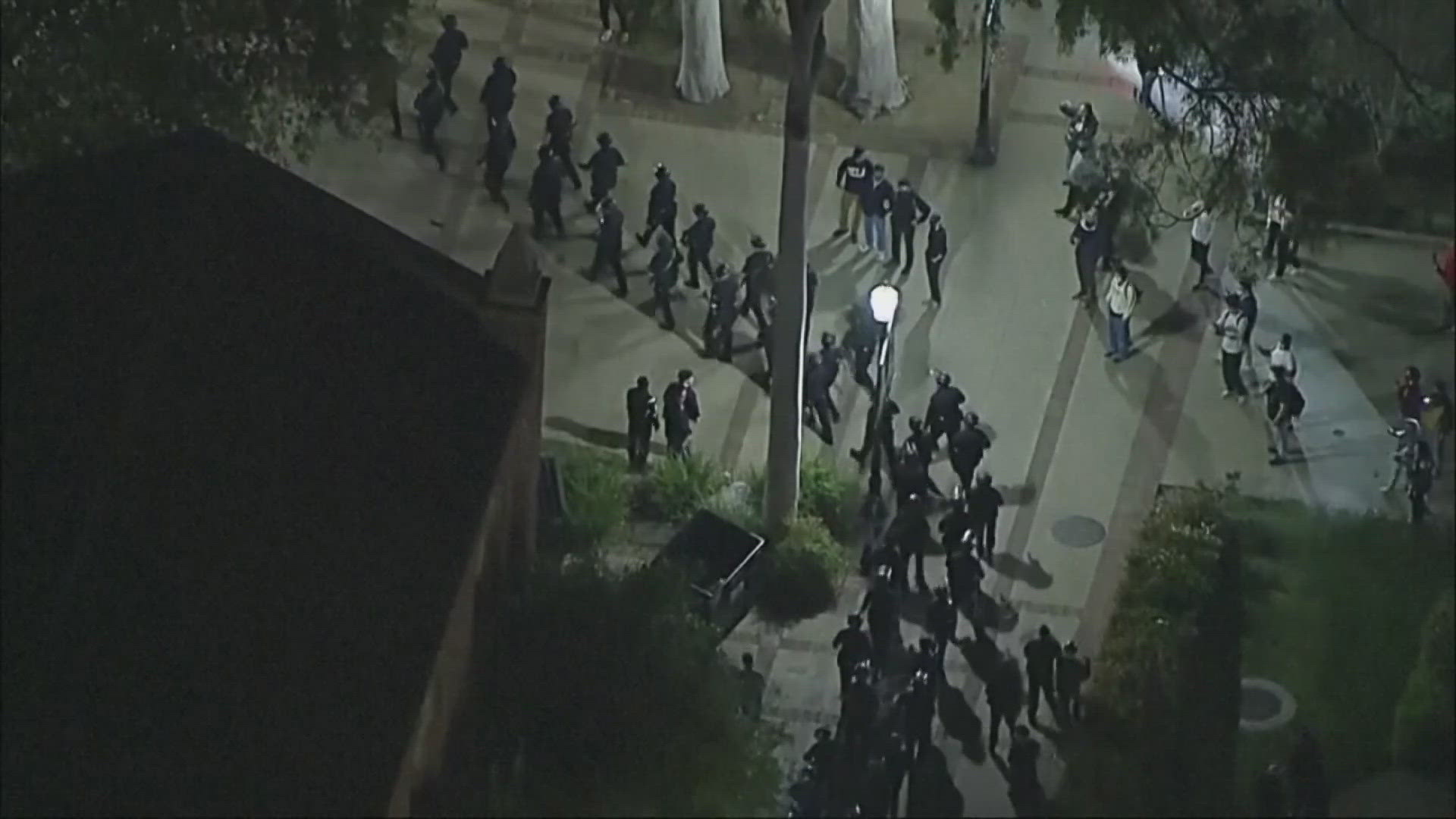 Police moved on the UCLA encampment early Thursday, tearing down barriers and using flash-bangs as they advanced.