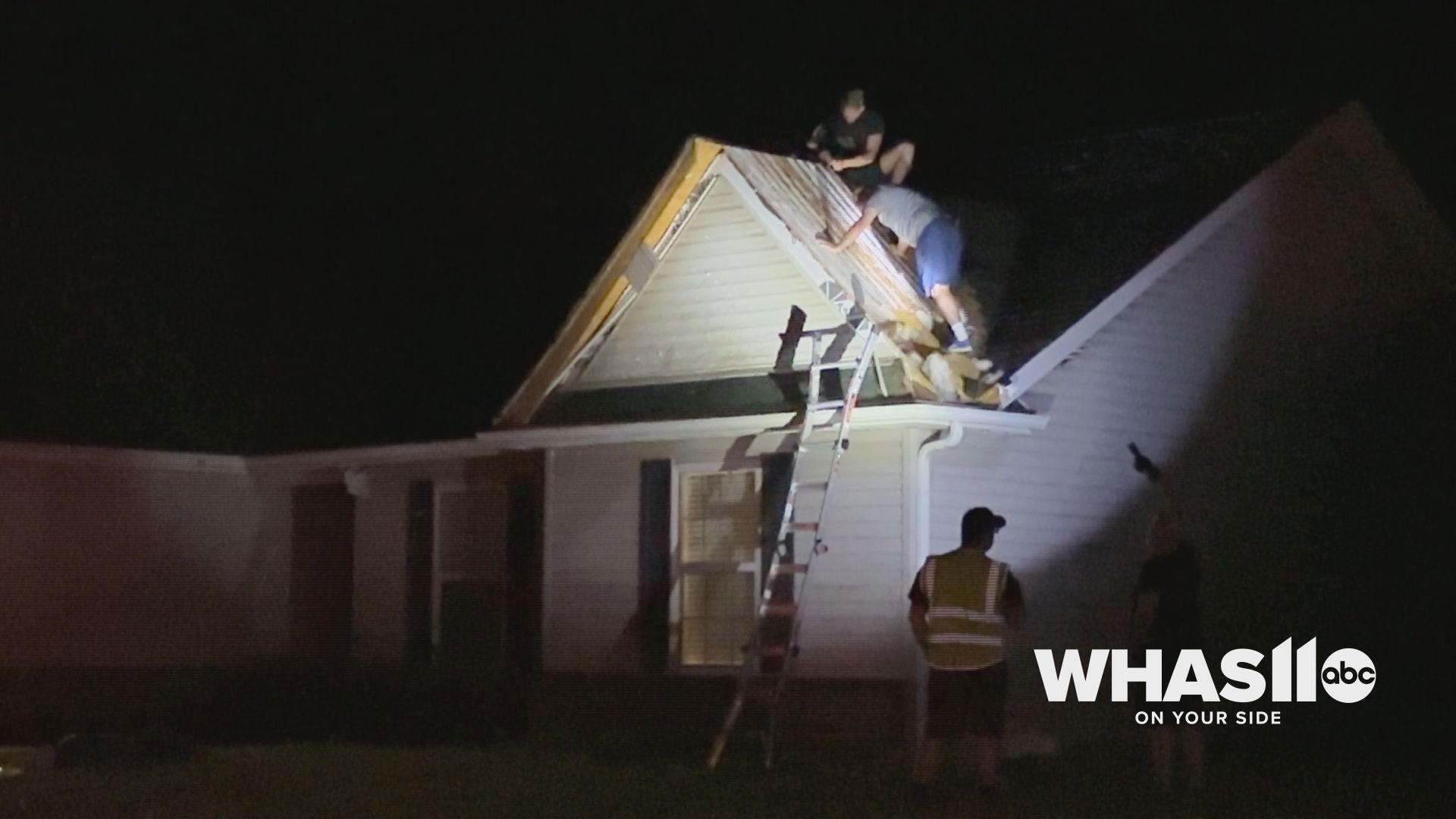 People are already working to repair the roof and protect the inside of the building after a storm went through the area on May 7, 2024.