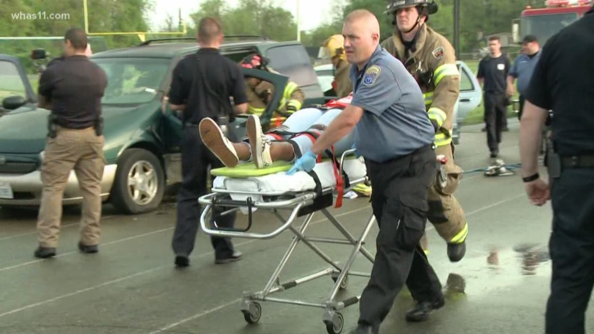 LMPD's traffic unit held the mock crash at Moore High School, showing that almost every person is at risk of becoming a victim to drunk driving.