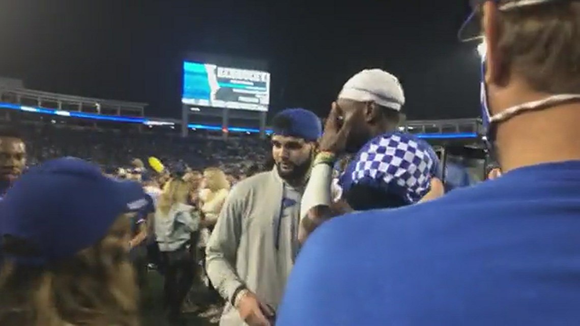 UK player takes photos with fans after upset win over Florida