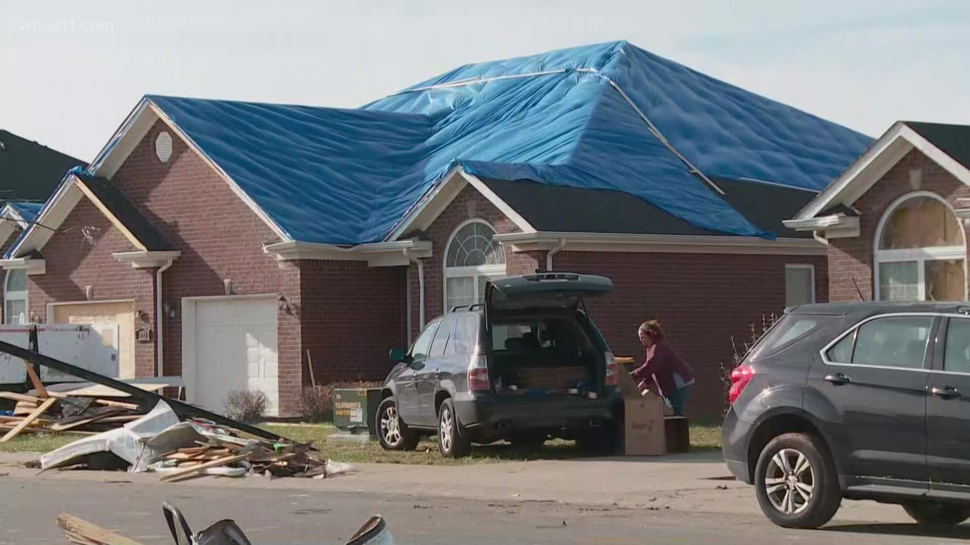 Property owners in Bowling Green race to get tarp on roofs of tornado damaged homes as the potential for lots of rain in the forecast.