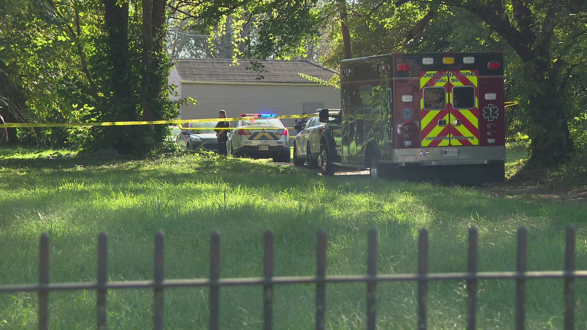 Louisville police said the car hit a tree and officers found the driver suffering from multiple gunshot wounds.