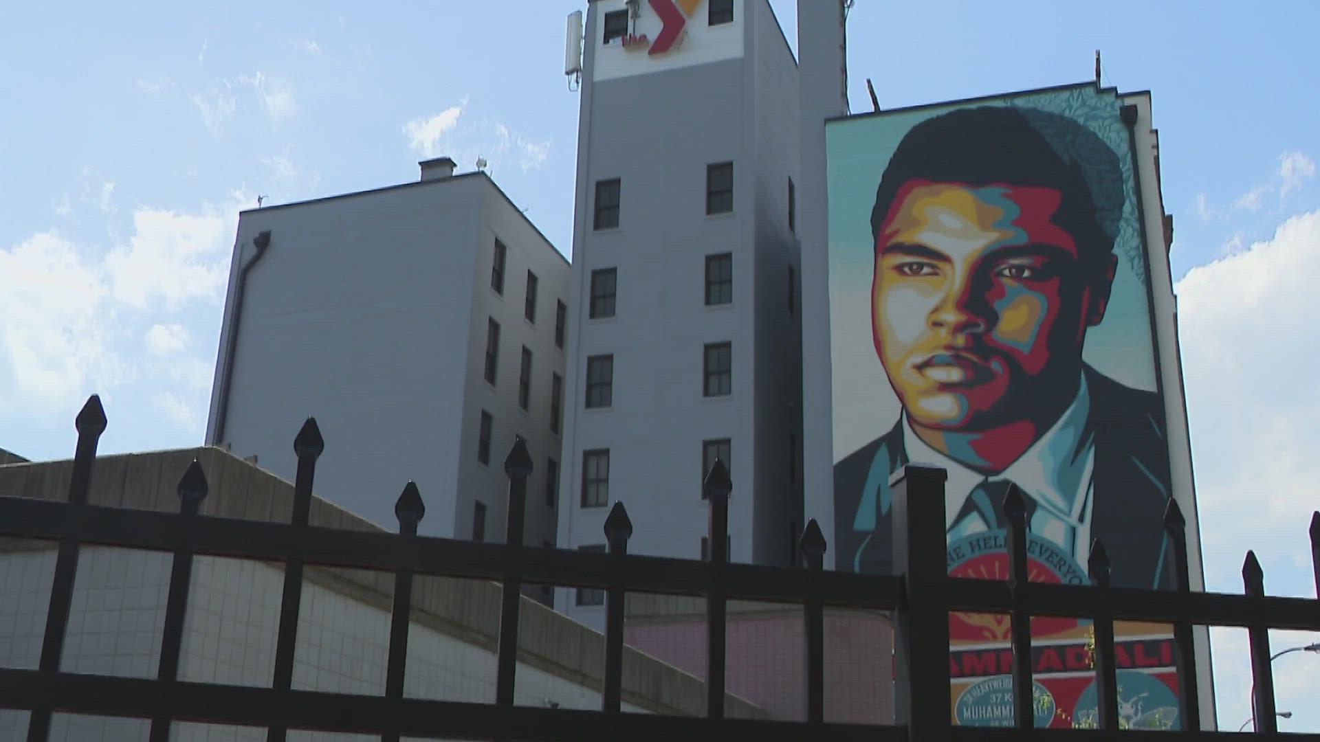 Artist Shepard Fairey painted the seven-story mural. He also designed the "Hope" poster for Barack Obama when he was running for president.