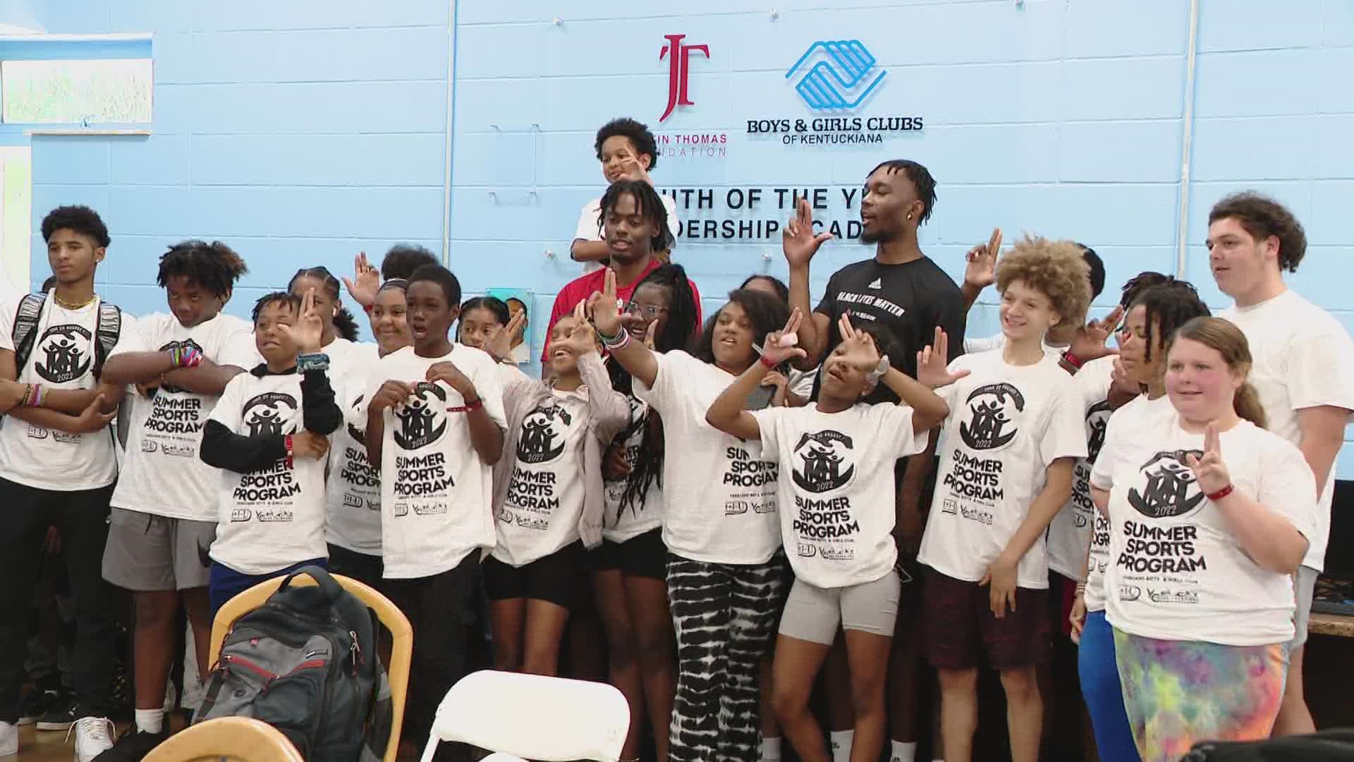UofL basketball players surprise Young Champions' camp