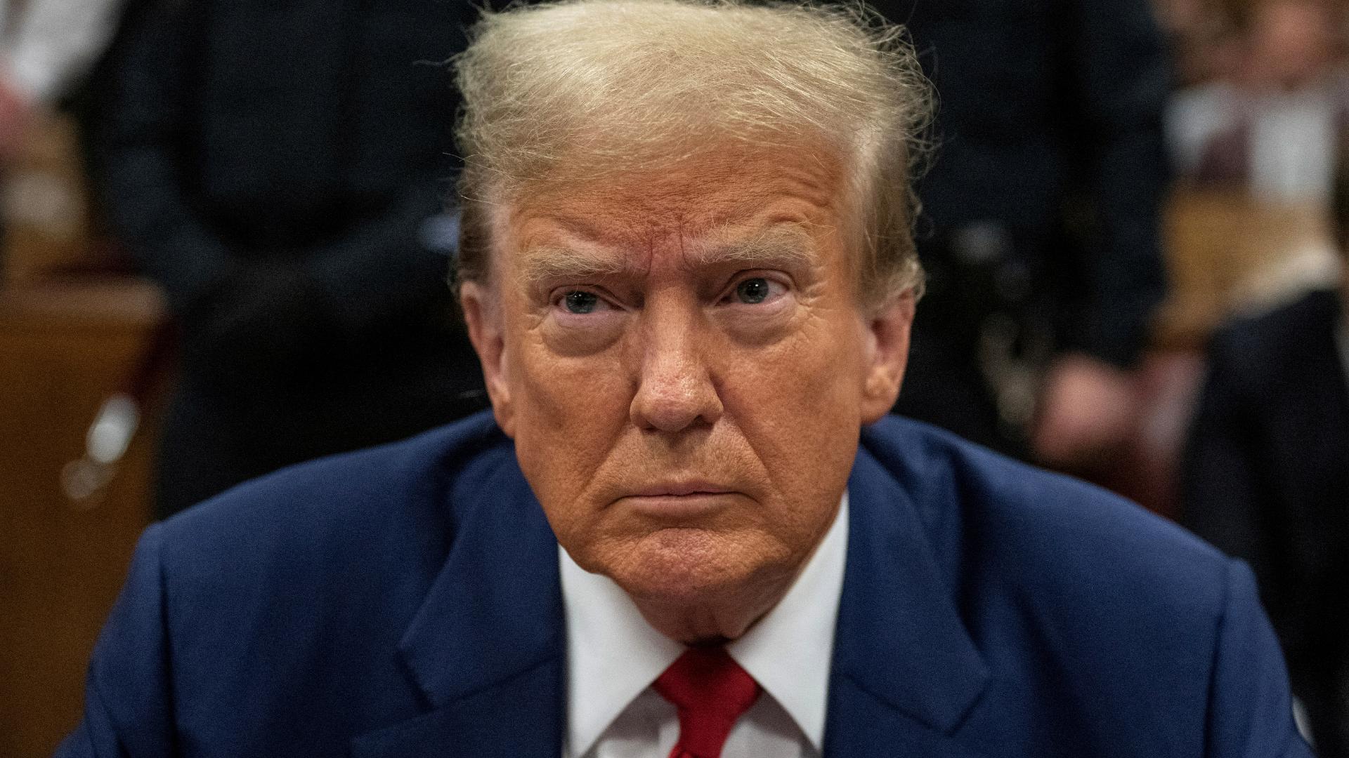 Prosecutors had alleged 10 violations, but the judge found there were nine. Trump stared down at the table in front of him as the judge read the ruling.