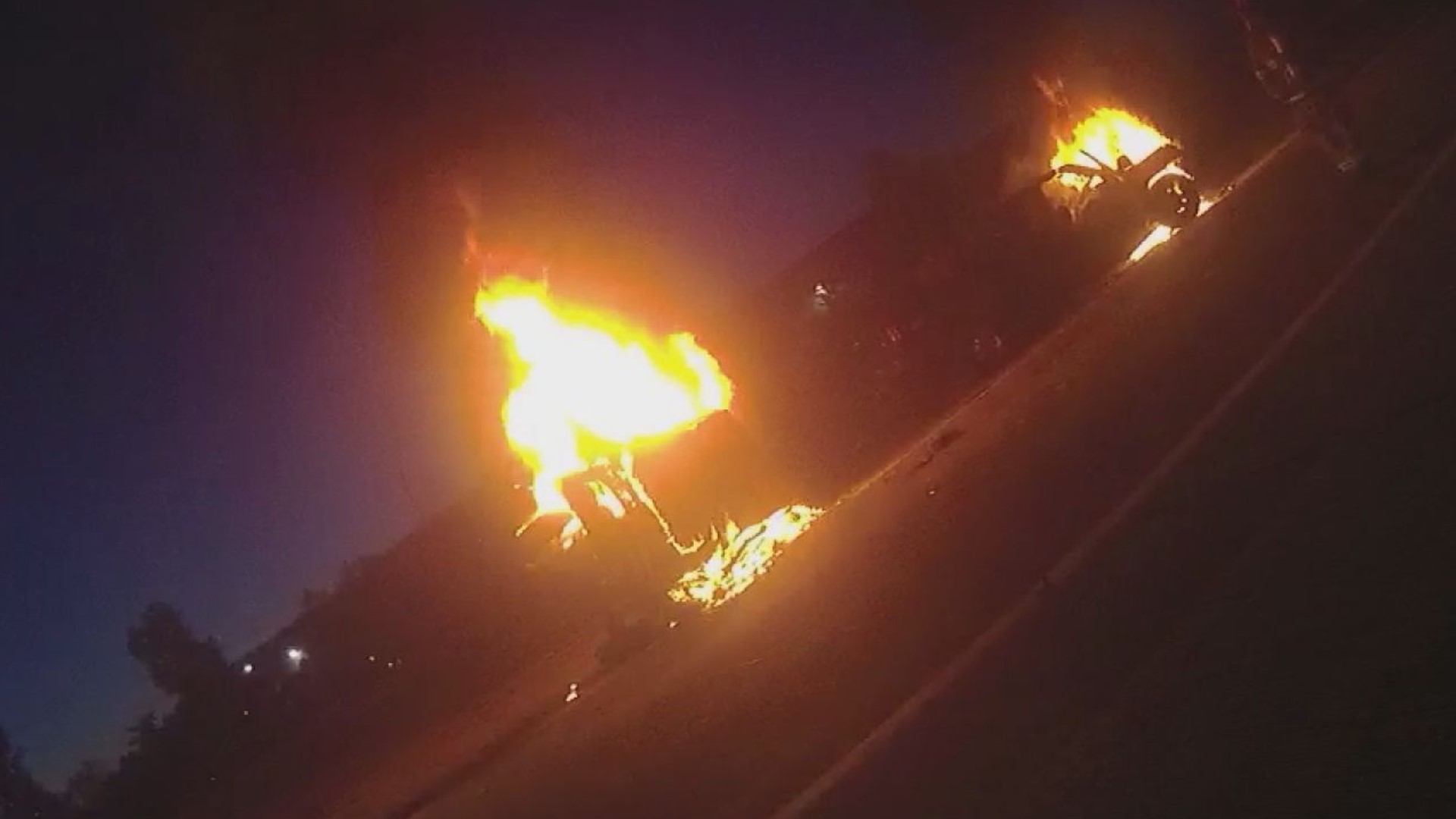 Two cars were engulfed in flames when officers arrived, both drivers unresponsive.