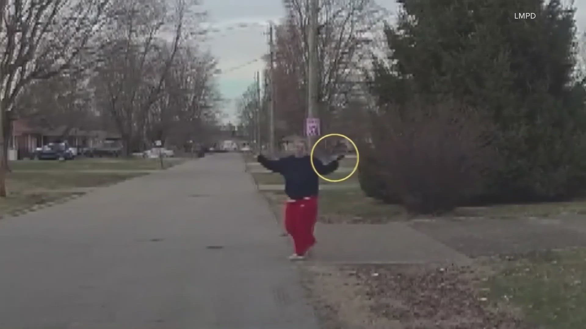 The footage shows when officers ordered the woman, Candy Basil, to drop her weapon.