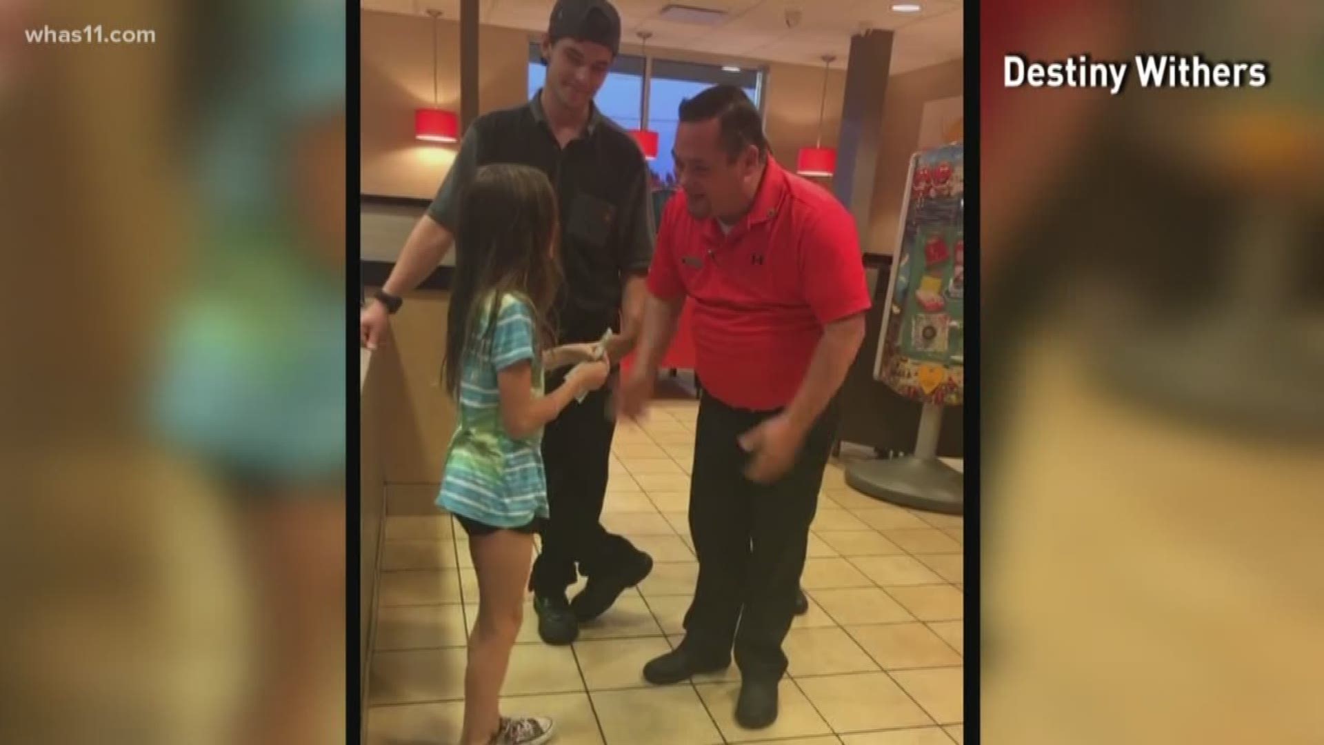 A little girl is thanking employees at a local McDonald's after they helped her reach her goal for the WHAS Crusade for Children.
