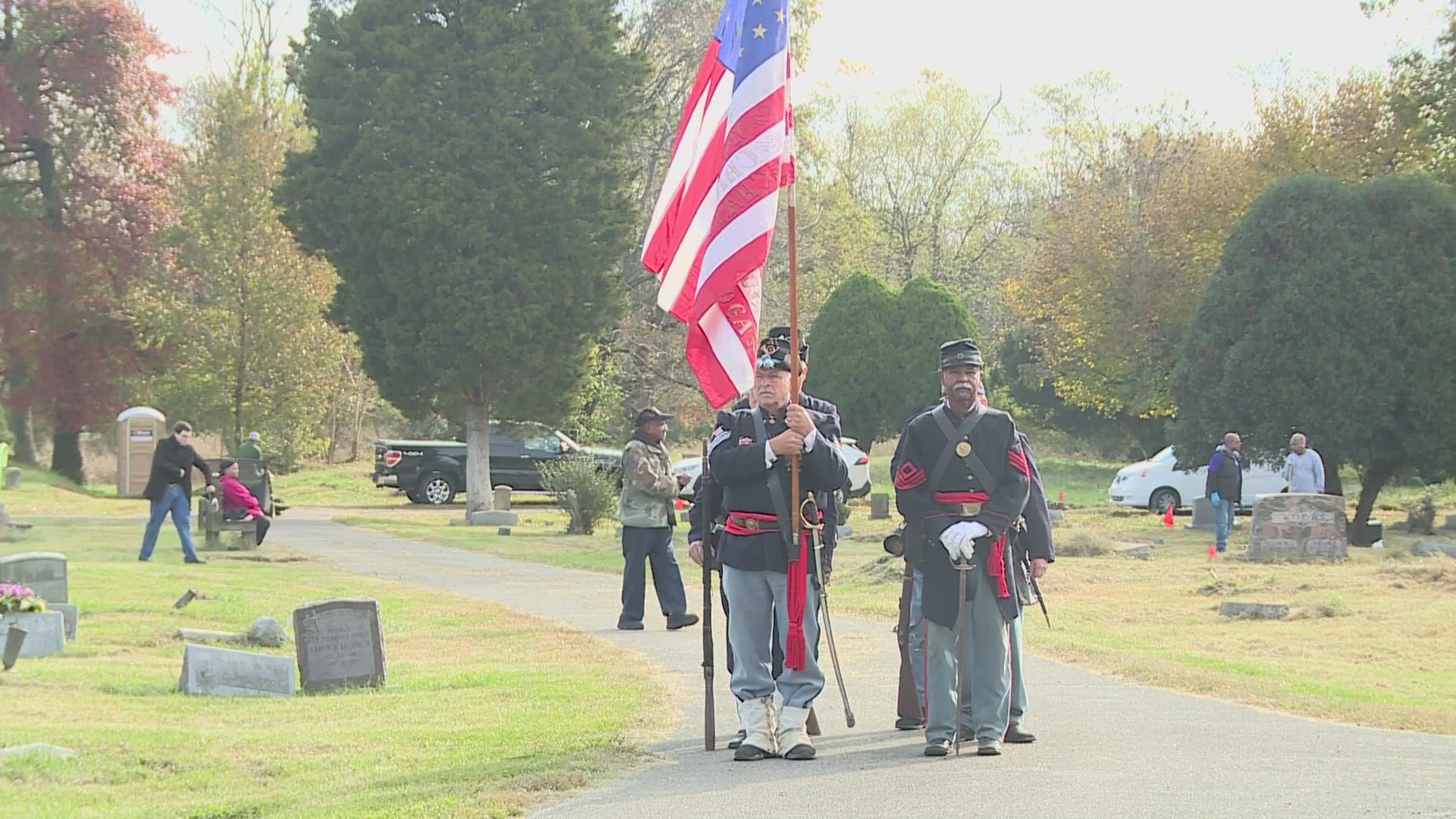 Rep. Morgan McGarvey and other leaders celebrated the sacrifices of Black veterans who are buried at Greenwood Ceremony in west Louisville.