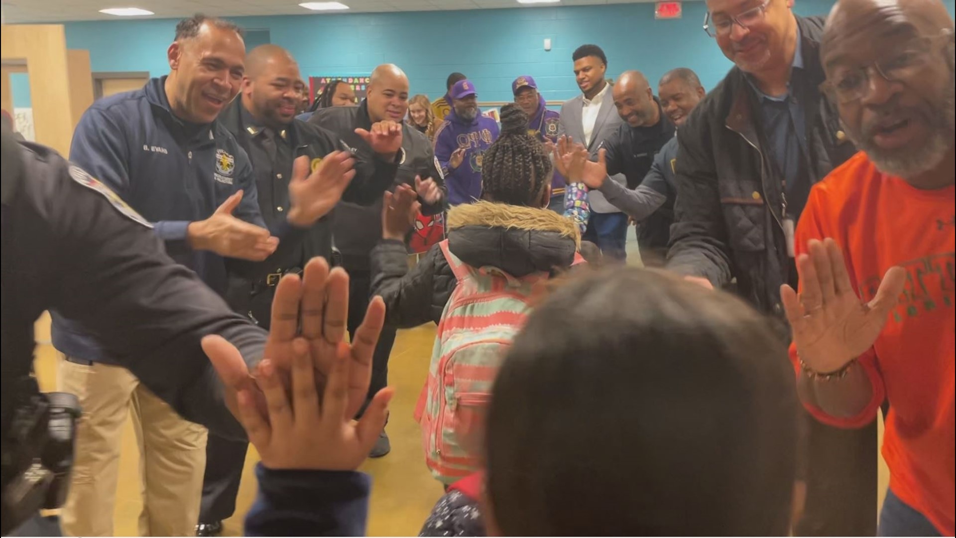 About 50 men took part in the Wednesday surprise for students at Indian Trails Elementary.