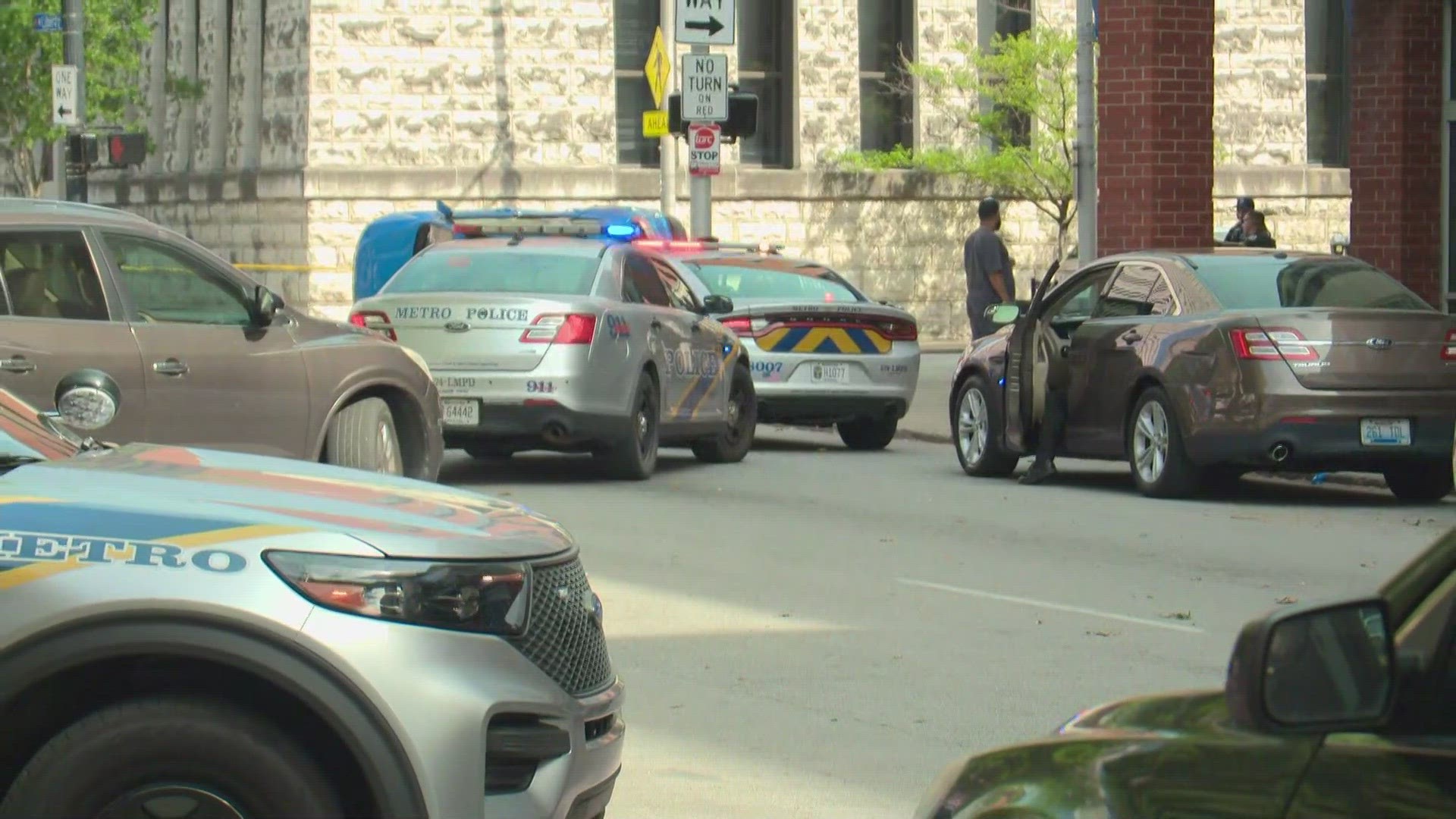 WHAS11 crews could see a car flipped over in downtown Louisville near Sixth and Liberty Streets.
