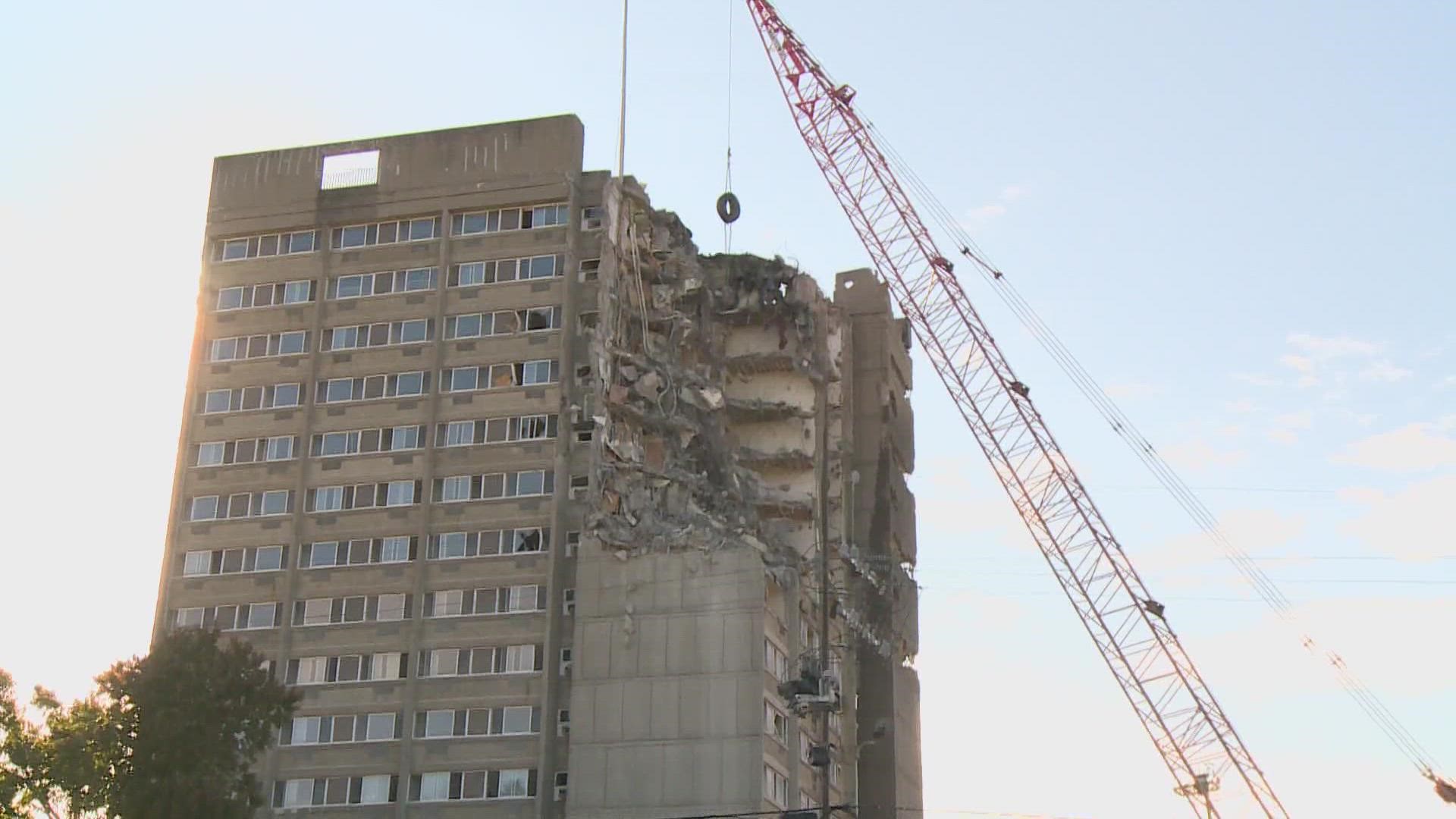 Several people watched as New Albany's tallest building was being demolished. The apartment complex went through a catastrophic fire three years ago.