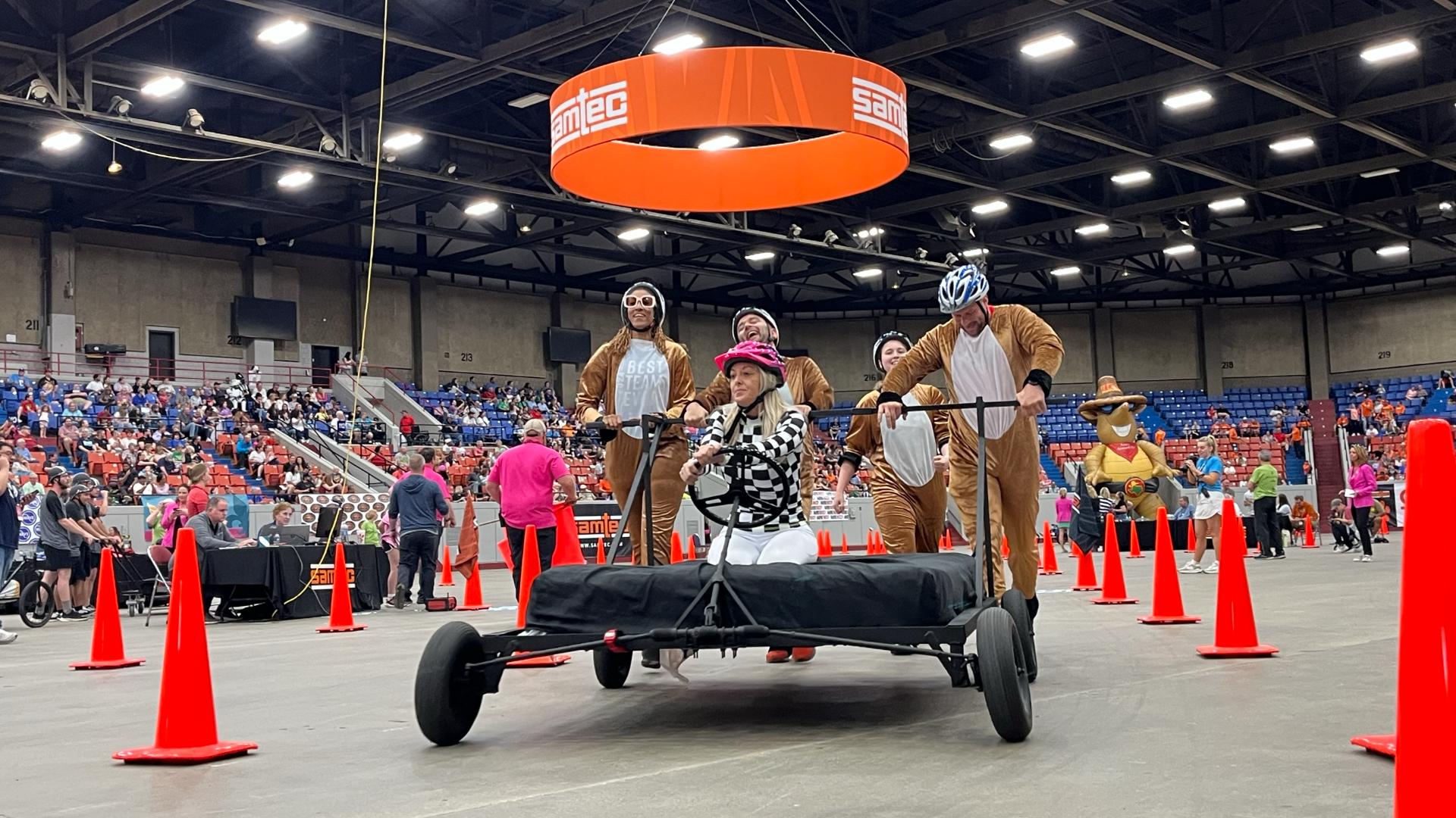 Teams gathered at Broadbent Arena to push their decorated beds around a figure eight course and competed for the fastest time during the 35th annual Great Bed Race.