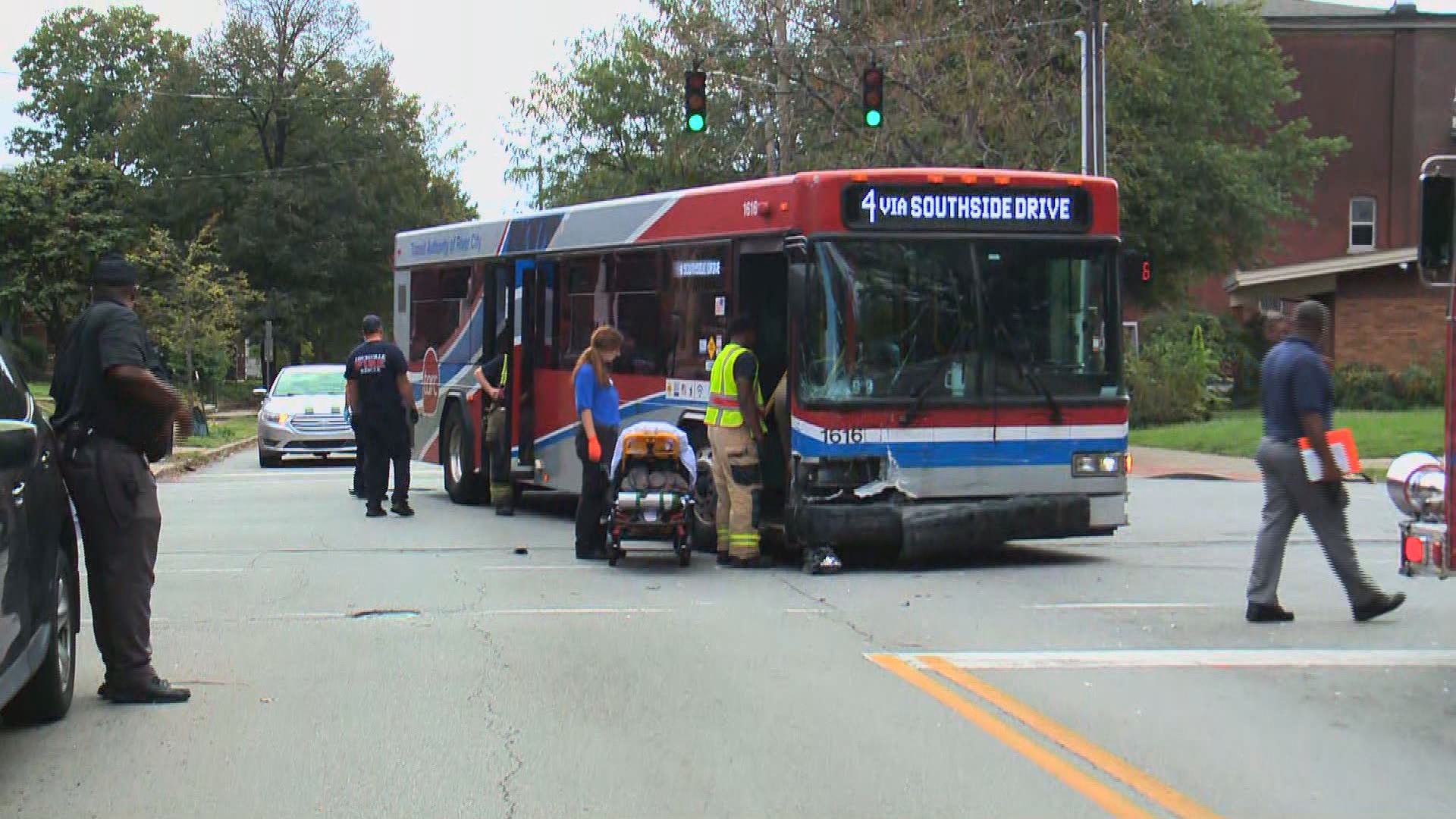 Authorities believe the bus hit a driver who may have run a red light.