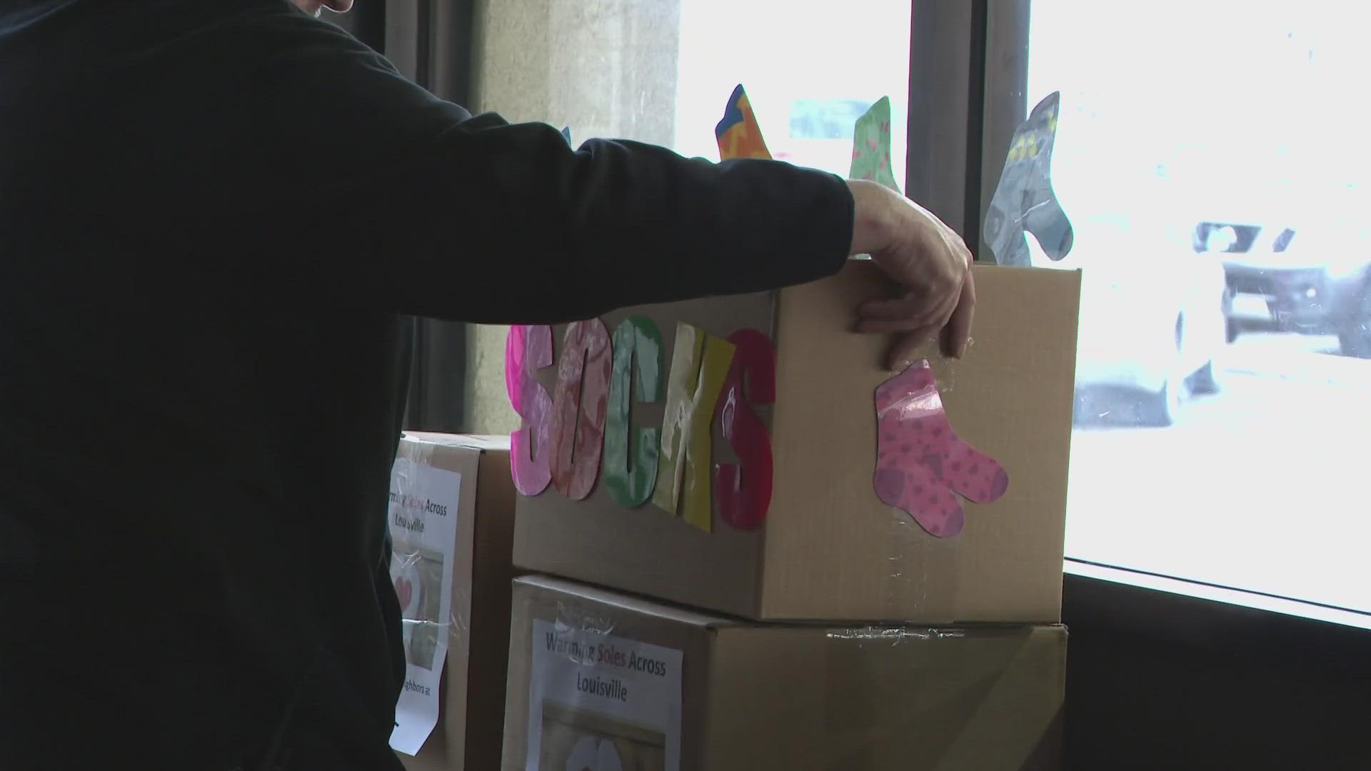 The shipping giant gave back to a Louisville shelter to help keep those who are houseless warm this winter.