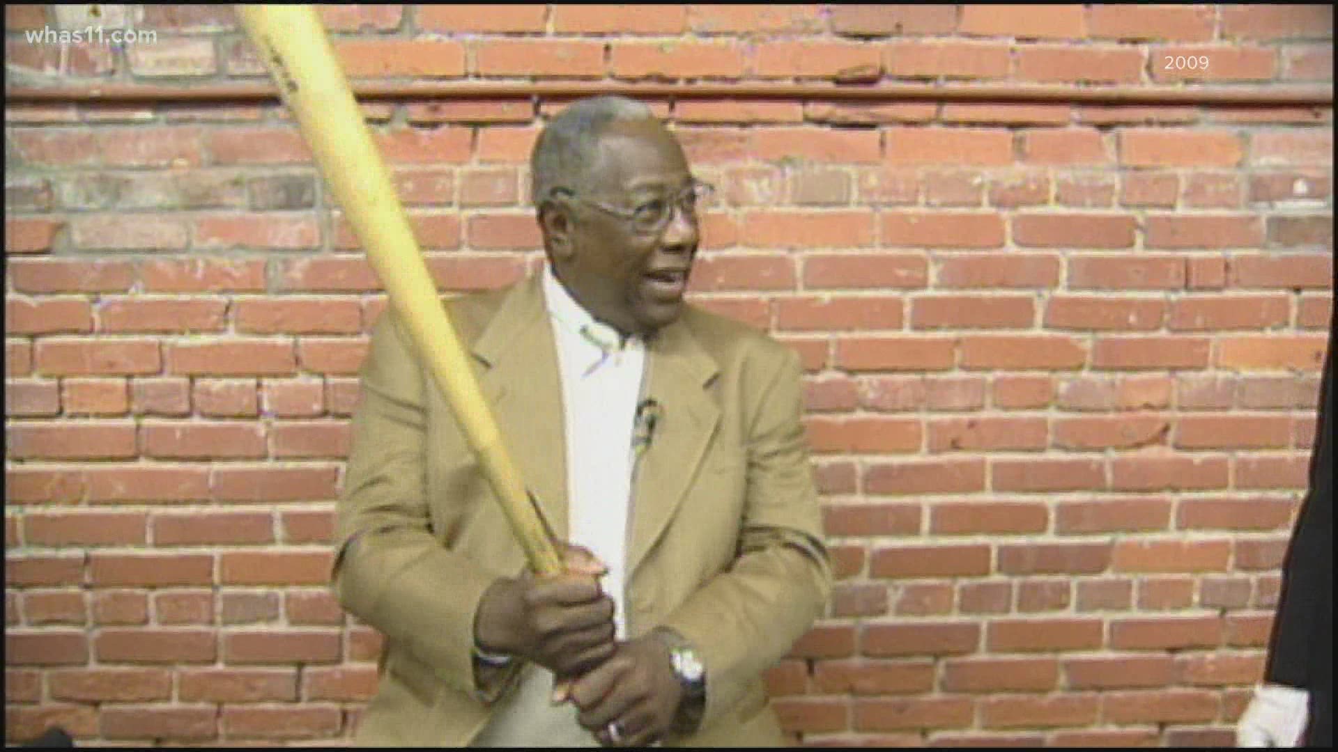 The home run king died in his sleep Friday. Aaron toured the Louisville Slugger factory in 2009 and his memorabilia is still on display.