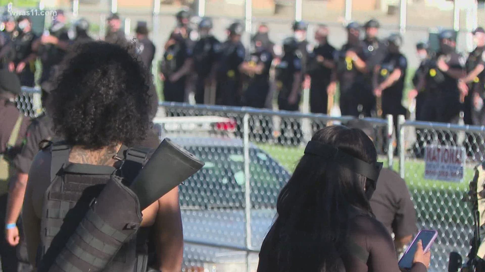 The Black militia group was back in Louisville urging police to use force from across the fence at Churchill Downs as they marched for justice for Breonna Taylor.