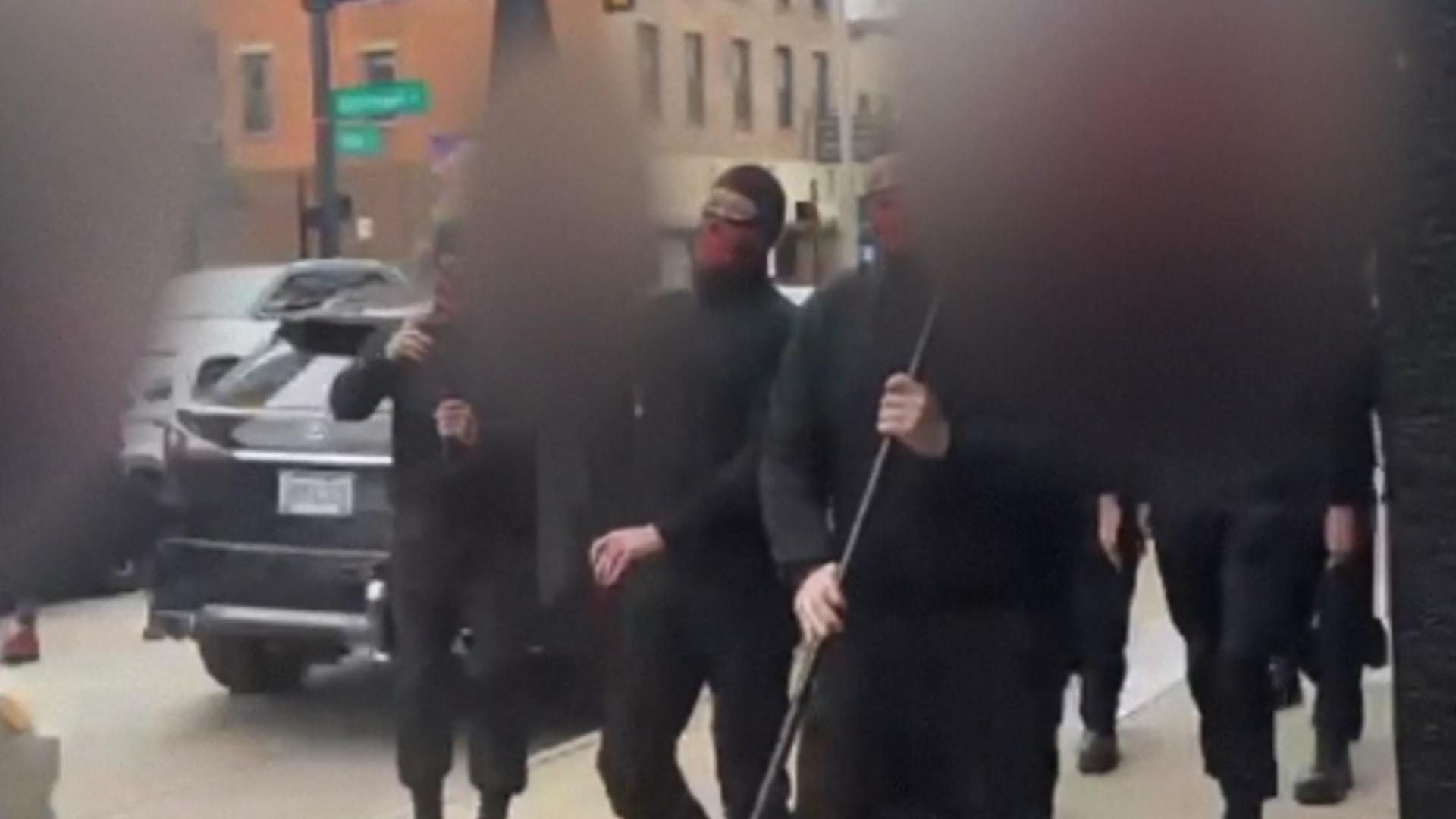 The incident happened on Saturday. Each person was dressed head to toe in all black with masks concealing their faces as they shouted racist speech.