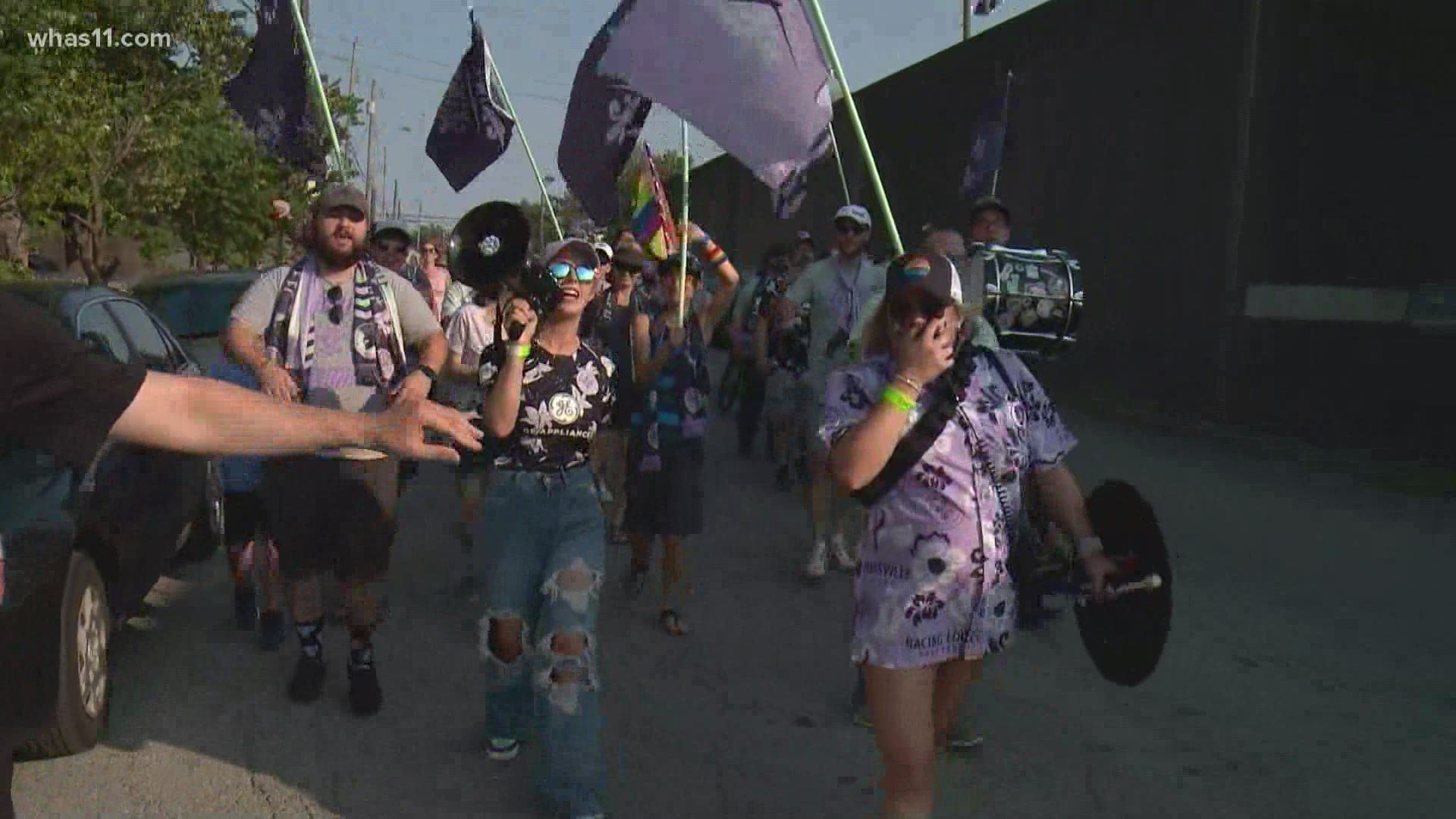 Fans of Louisville's women's soccer team marched to cheer their team on as they take on the Portland Thorns.