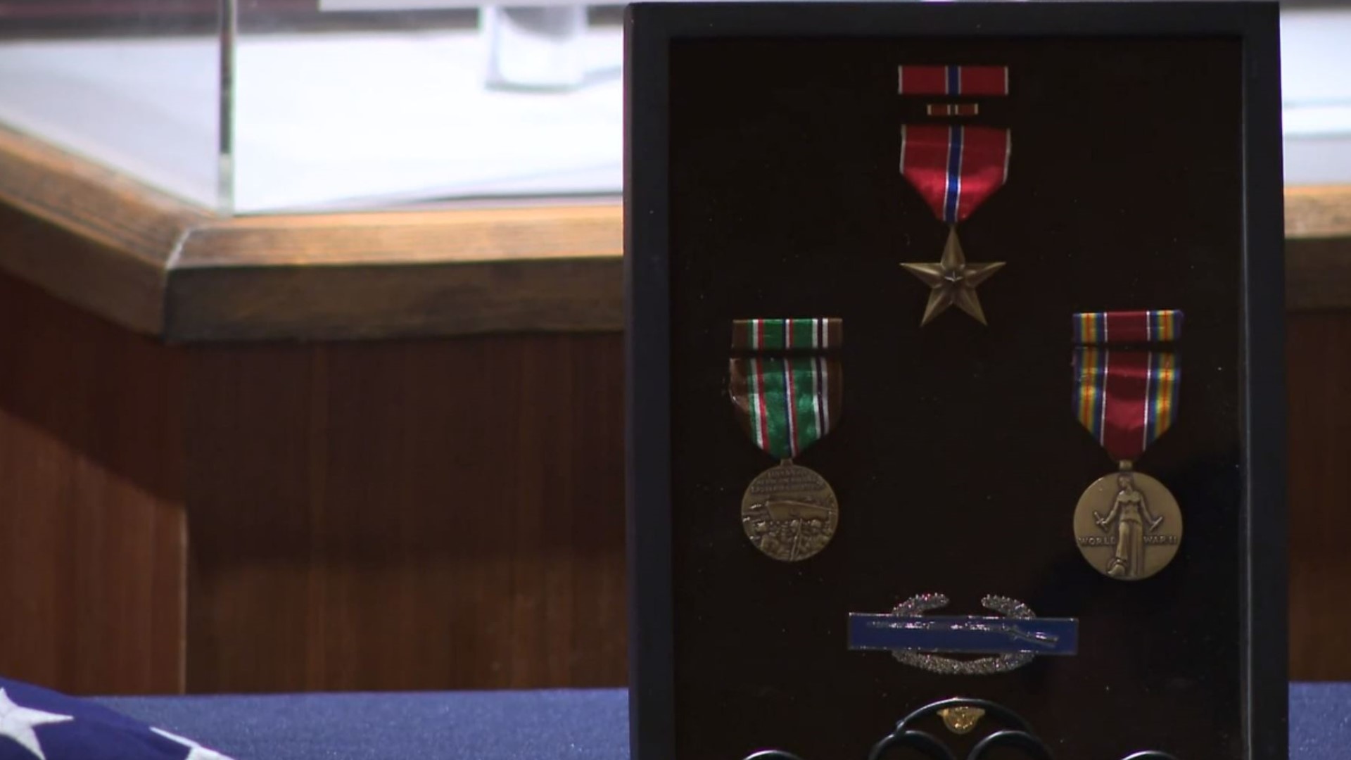 Decades after a WWII battle in France, Staff Sergeant Howard Reed was awarded several metals, including a bronze star.