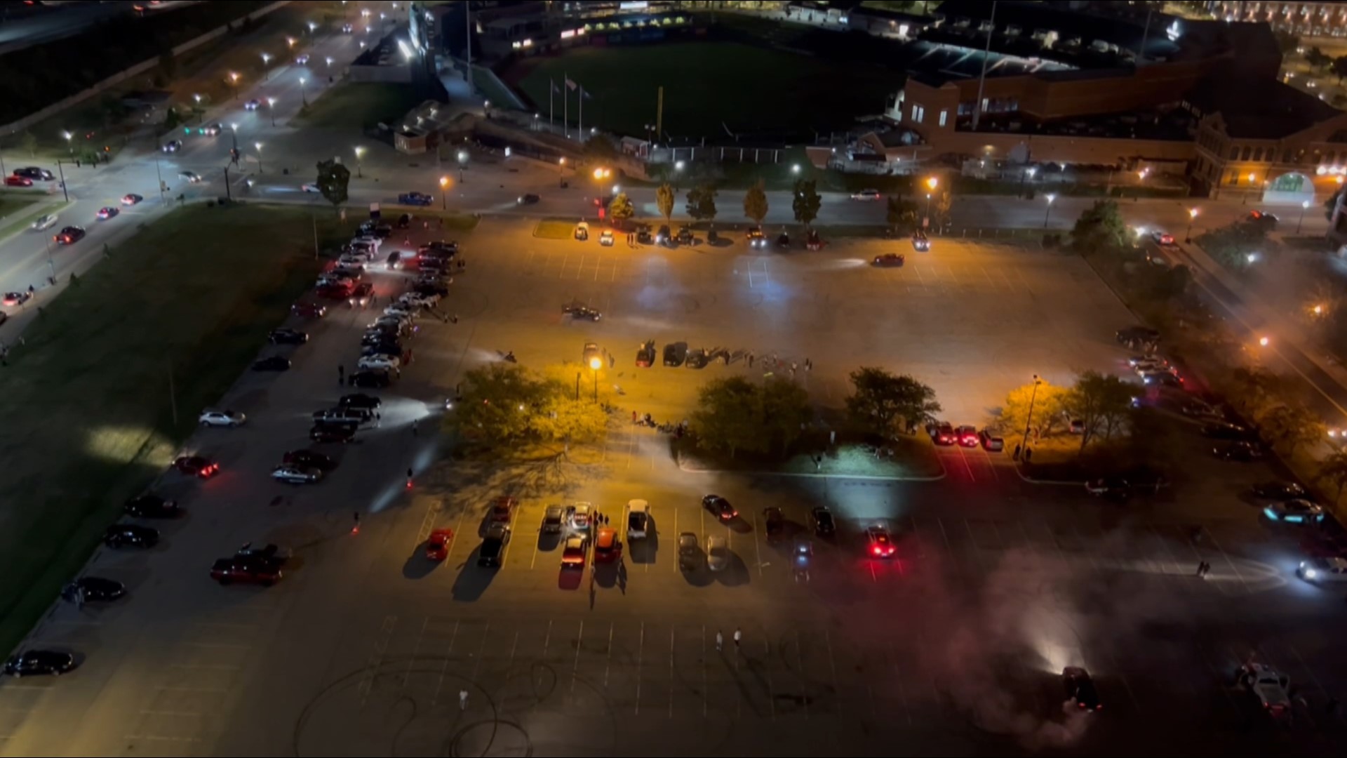 Neighbors captured this video in the parking lot west of Louisville Slugger Field around midnight on September 16 that had about 300 cars in street racing.