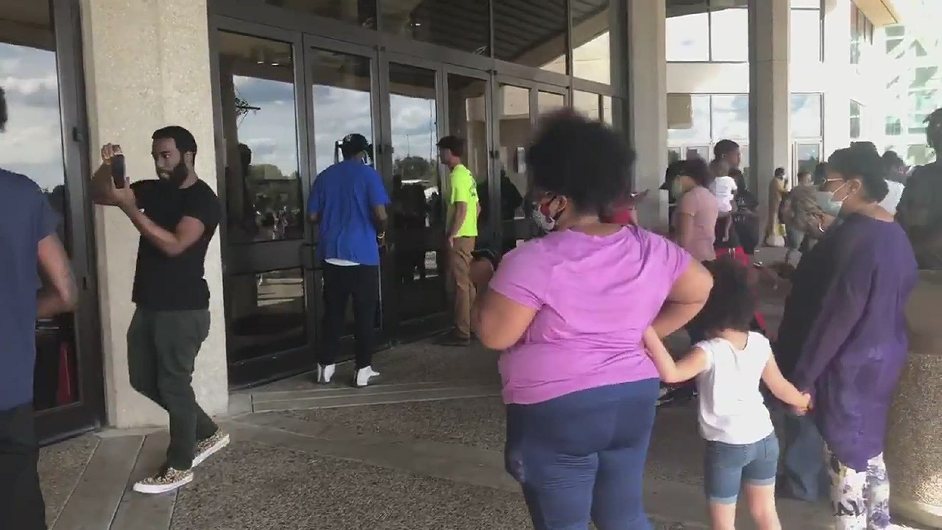 Voters who were outside the Kentucky Expo Center were allowed in. Charles Booker campaign encouraging voters to stay in line, while judge reviewed his injunction.