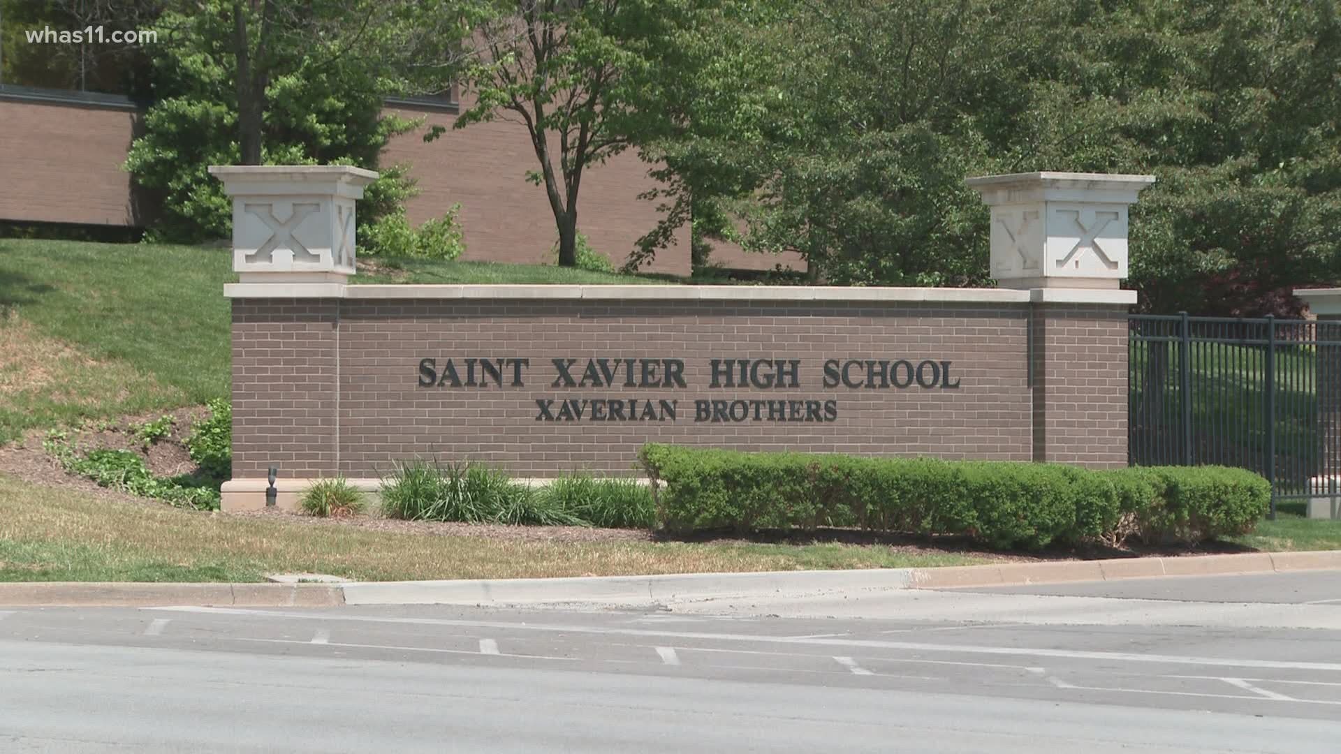 St. Xavier High School said officials are looking into a "disturbing video recorded off campus involving a few" students.