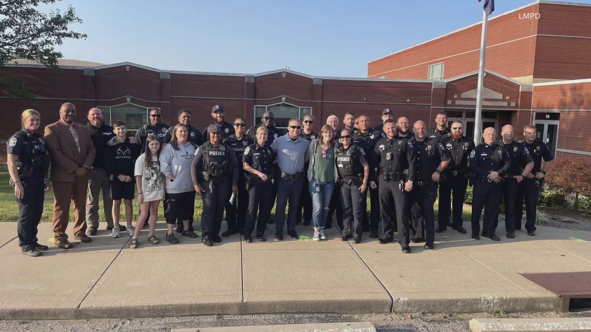 Officers from LMPD's first division lined the entrance to welcome students, fallen Officer Zachary Cottingim's son Riley, who had his first day of kindergarten.