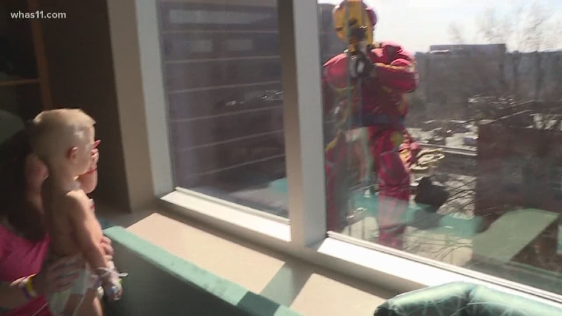 At Norton Children's Hospital, the window washers were decked out in superhero costumes, giving children and parents a reason to smile.