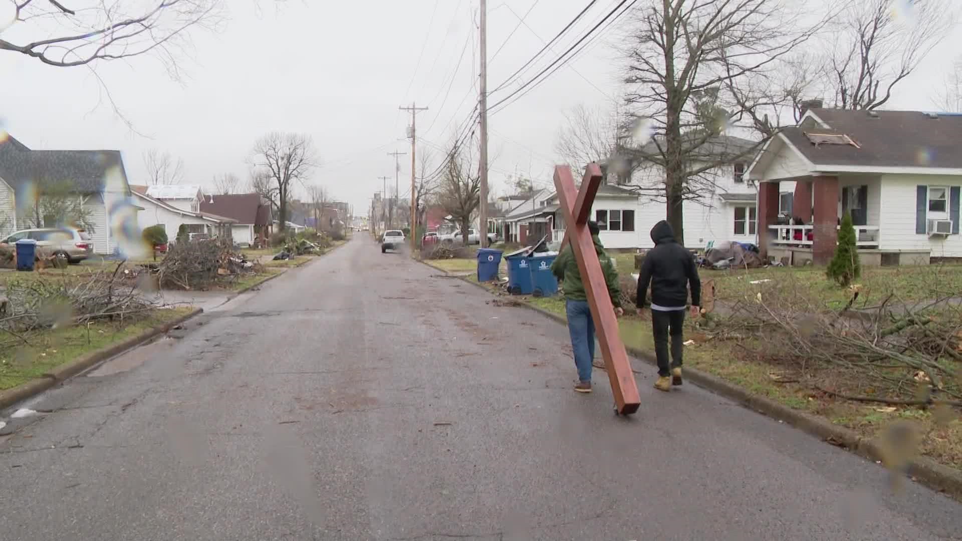 Volunteers are coming all over to help the town of Mayfield get through the destruction of the tornado. Some don't carry hammers or a broom, but a message.