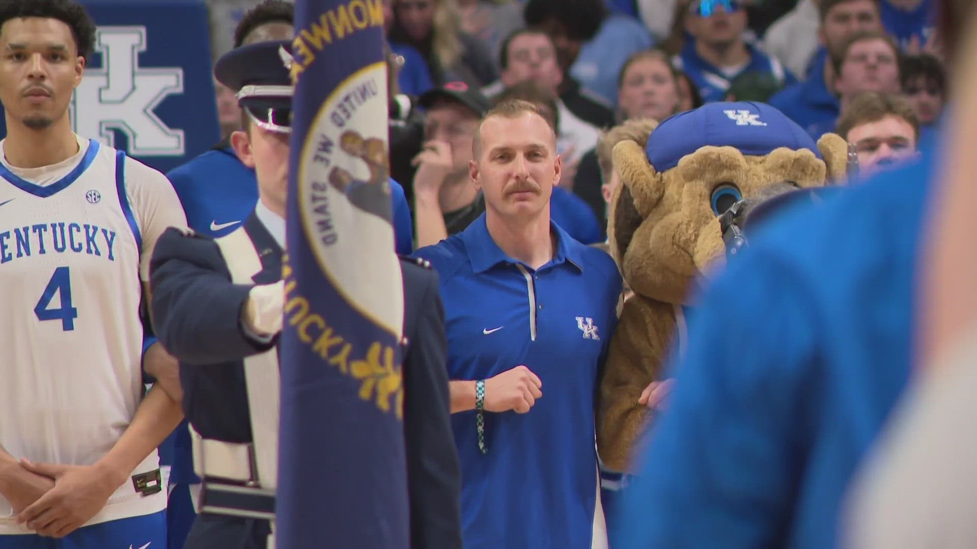 Bryce Carden, the Louisville firefighter who rescued a semi driver after a multi-vehicle crash on Friday, March 1, was honored before the national anthem.