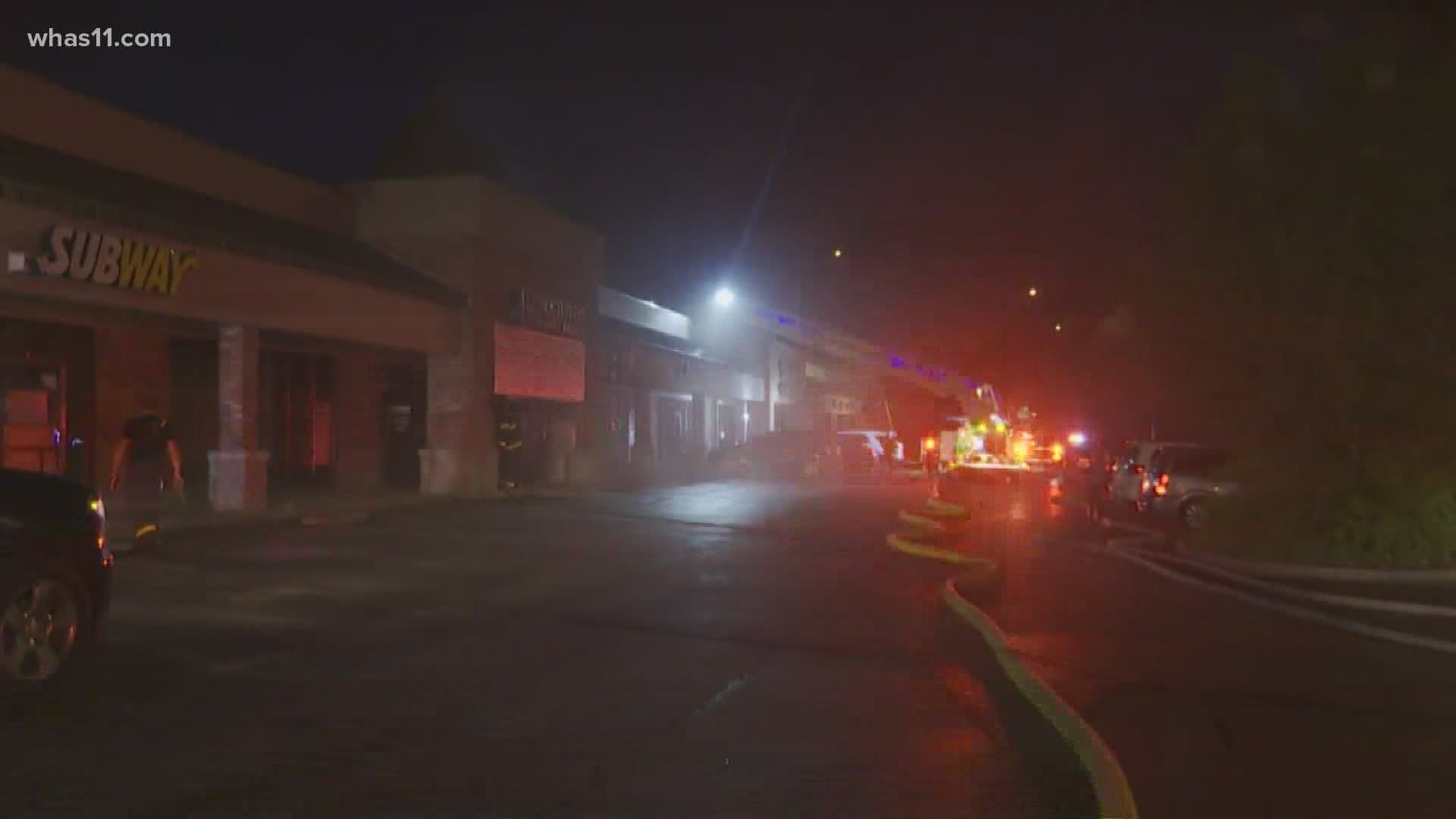 Authorities are investigating a fire at a strip mall near State Street.