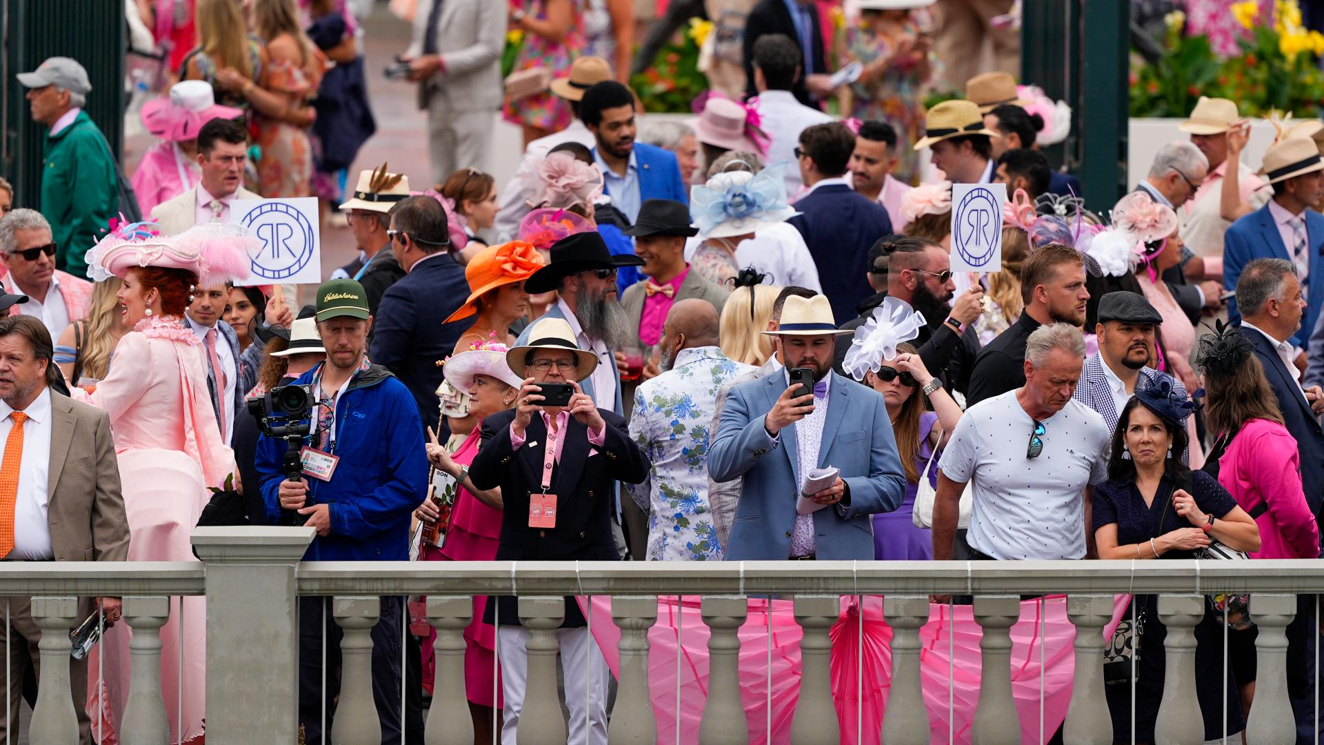 The sea of pink of more than 100,000 was spread throughout Churchill Downs and guests traveled far to see the 150th Kentucky Oaks.
