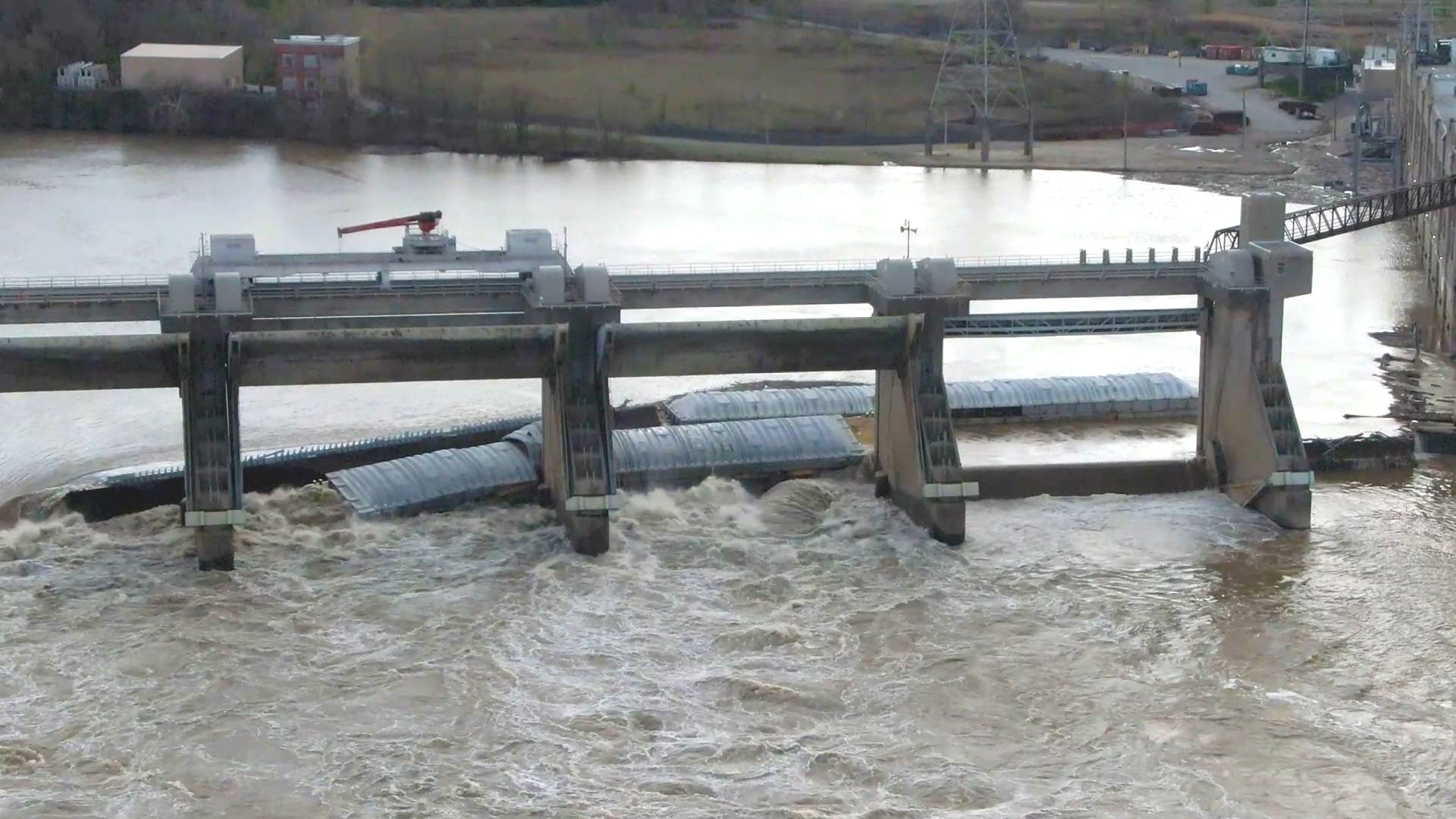 One of the barges was reportedly carrying 1,400 tons of methanol and is partially submerged at the McAlpine Dam.