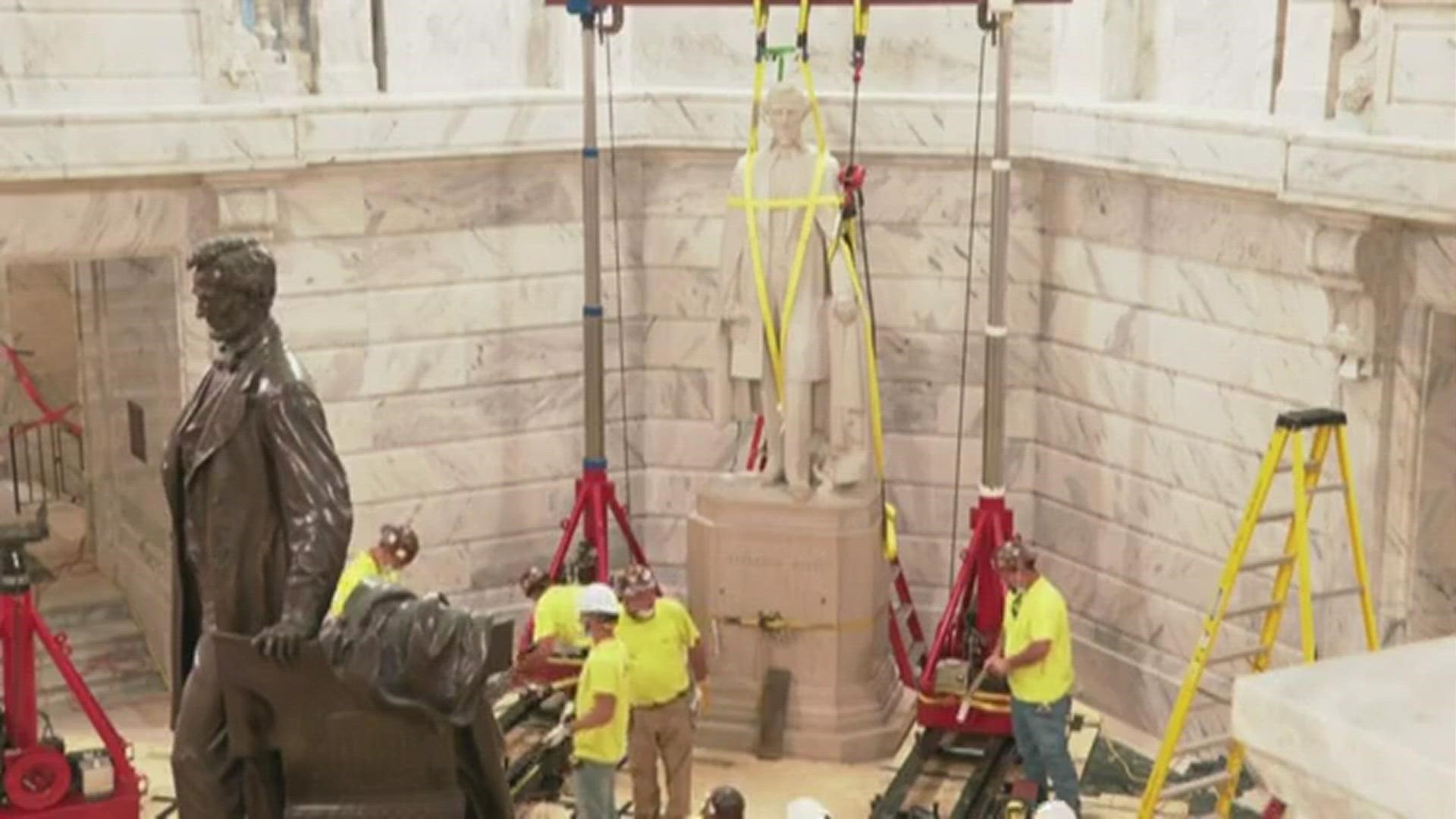 Gov. Andy Beshear was there as crews worked on the removal process. He ceremoniously pushed button to a rig that lifted the marble statue off its pedestal.
