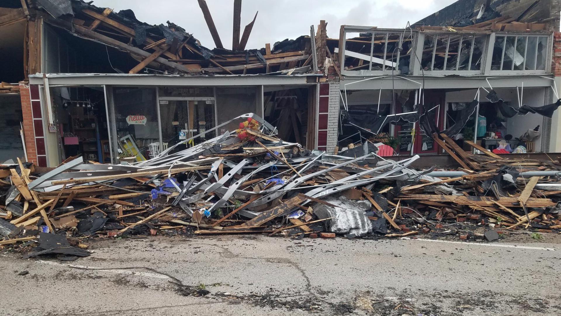 An infant is among the dead after the destructive outbreak of severe weather flattened buildings and injured 100 across the state on Sunday.