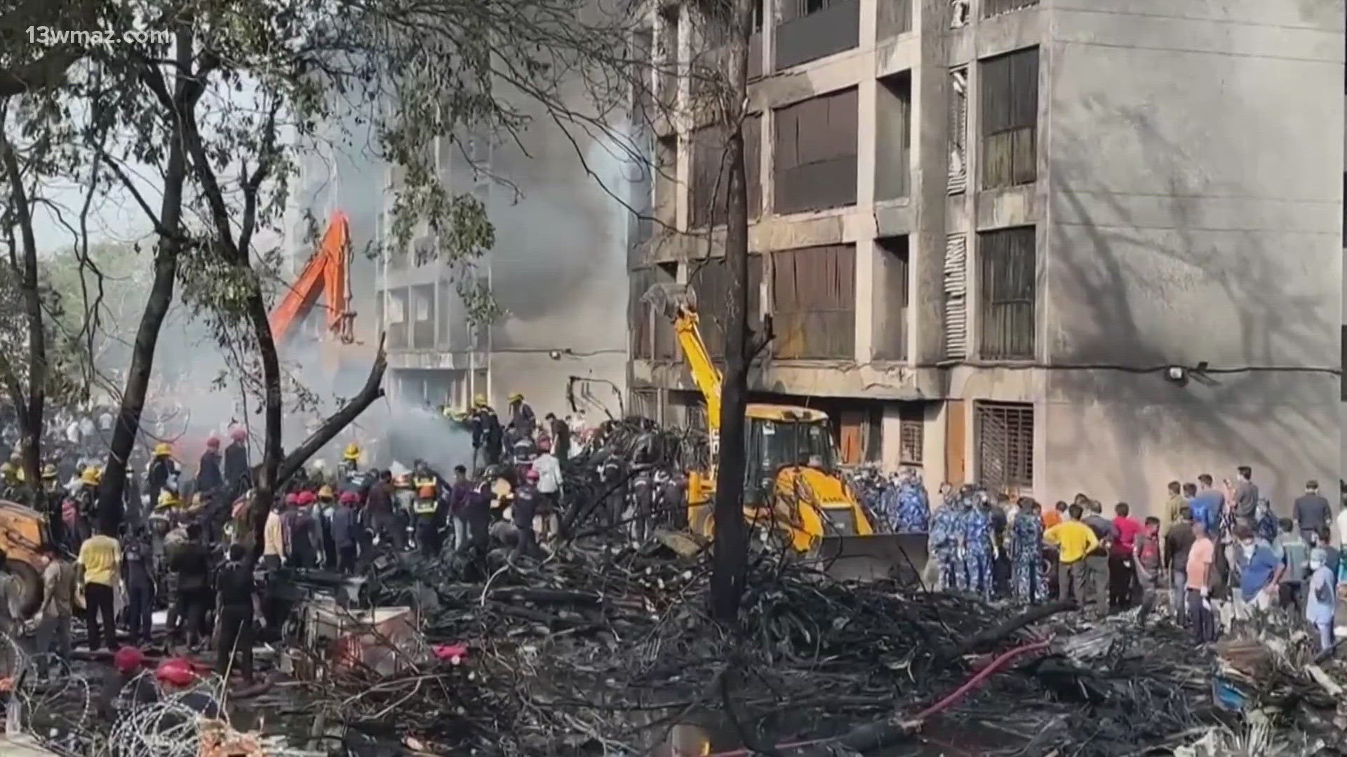 At the crash site, the tail cone of the Air India passenger plane with damaged stabilizer fins still attached to it was lodged near the top of one of the buildings.