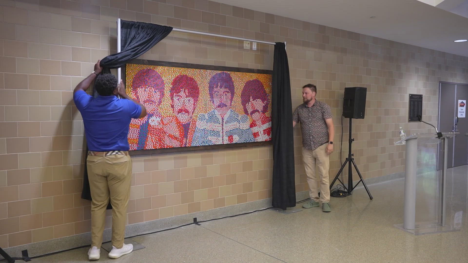 Indiana-based artist Cory Heimann created a mural featuring the four members of The Beatles for the Indiana State Fairgrounds Coliseum.