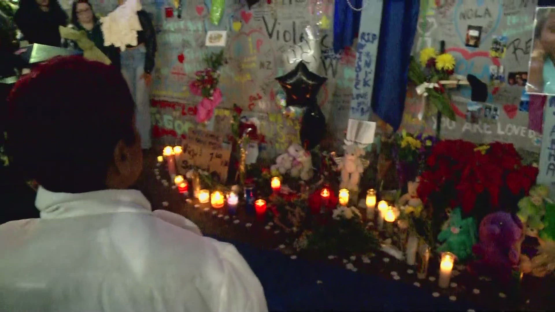 A silent moment as people gather to remember the lives lost in the Bourbon St. terror attack in New Orleans.